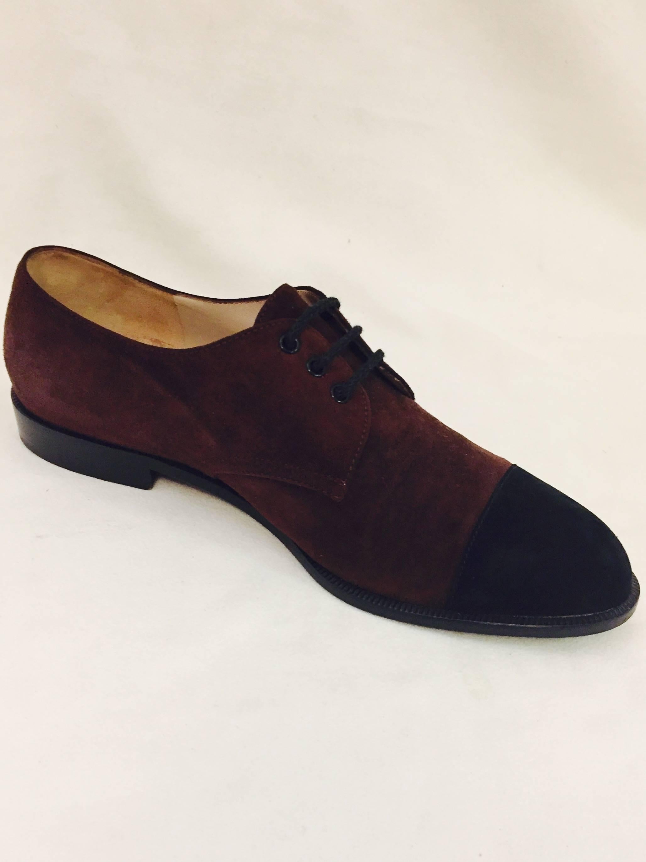 Chanel Brown Oxford Shoes With Black Cap Toes are quintessentially classic!  Features supple suede uppers and tan leather insoles and lining.  Simply a must for any sophisticated, modern fashionista!  Made in Italy.   