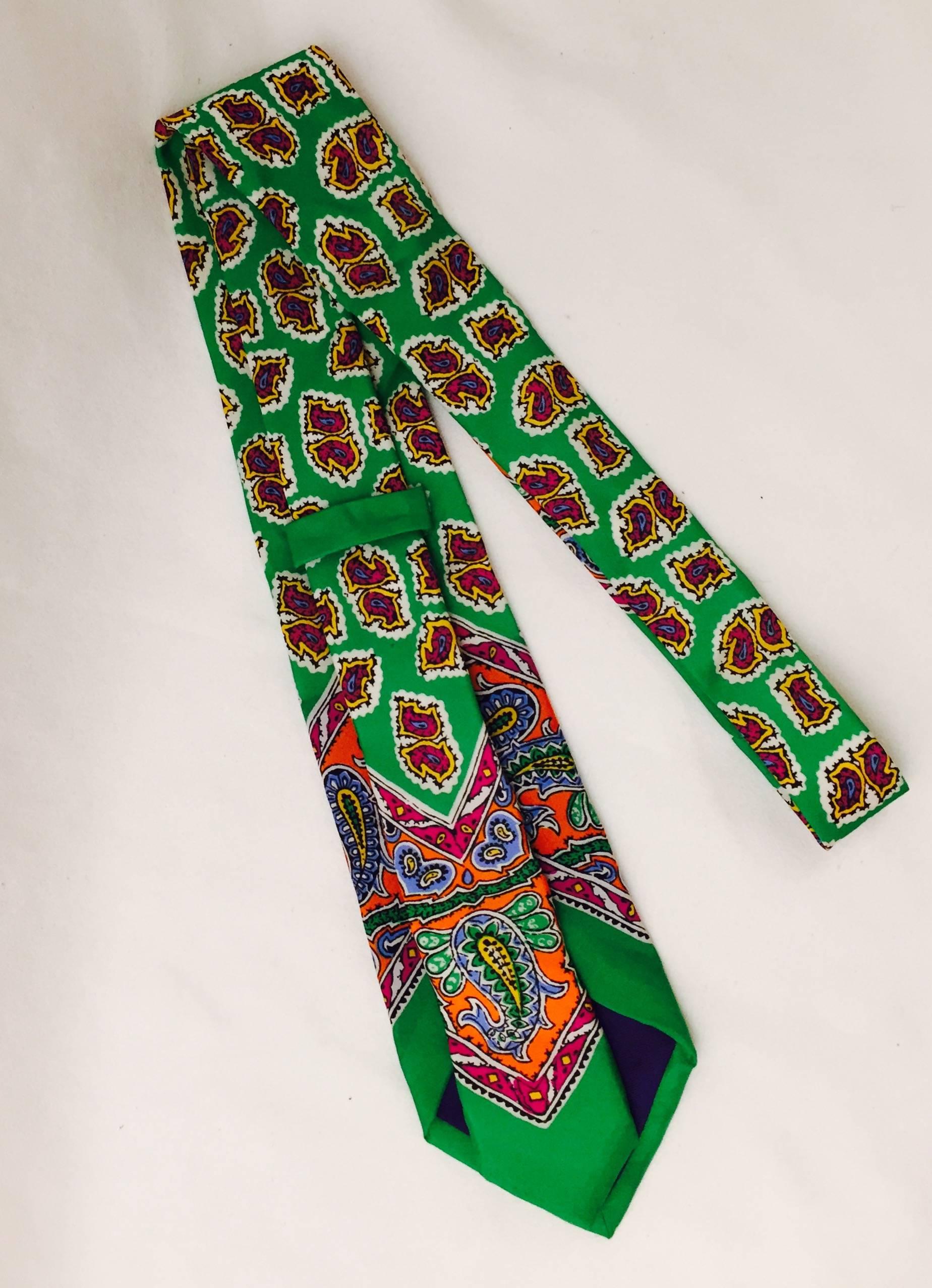 Wonderfully vibrant colours stand out in this tie and scarf set by Ralph Lauren Purple Label.  In paisley chartreuse with orange, blue, yellow  and cerise tones.  The tie is 58 inches long, and the scarf is 25 inches by 26 inches, 