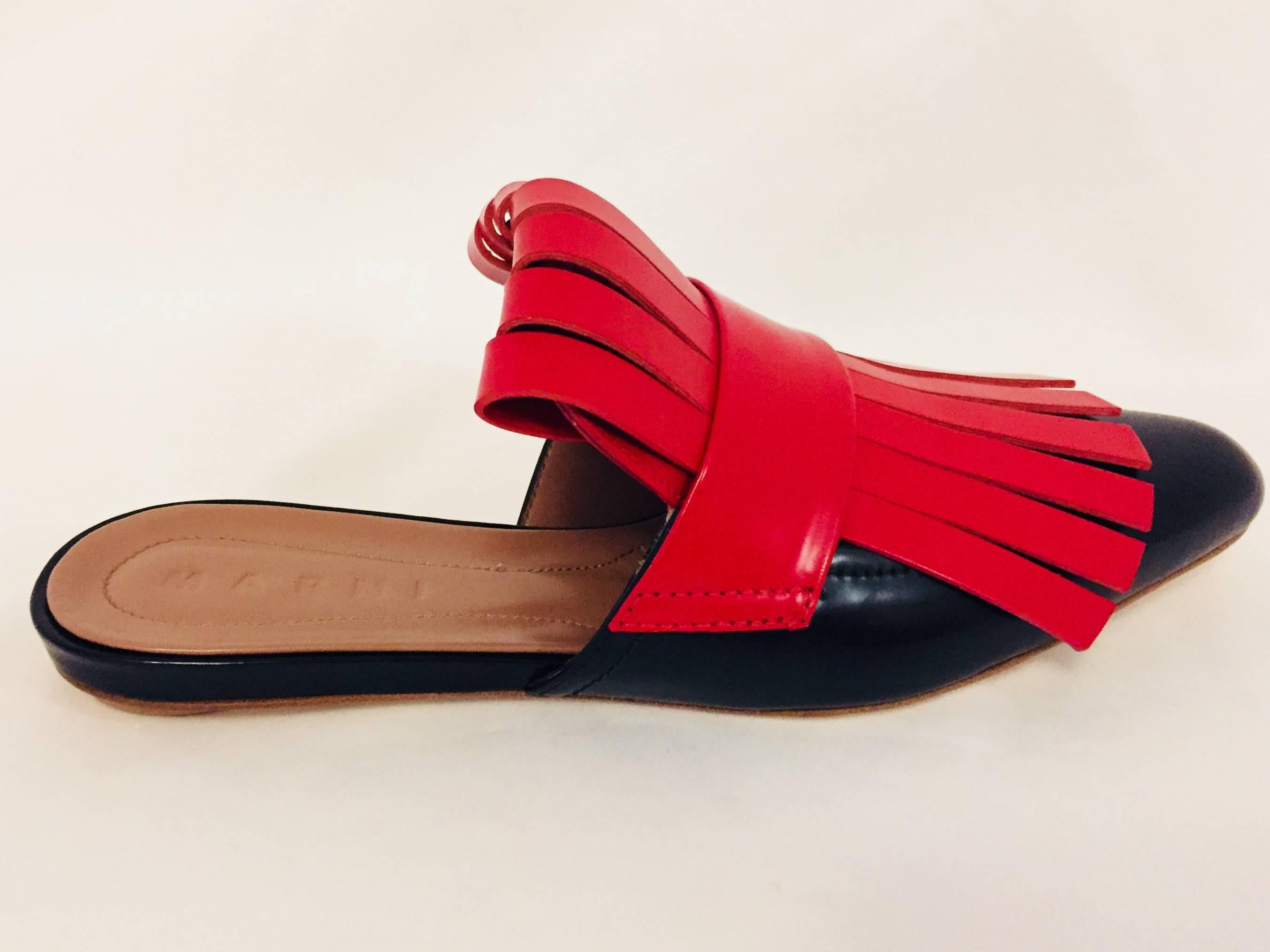 Marni's leather sandals in shiny black and bright red leather fringe. The mules are lined in taupe leather and the soles are also 100% leather.  Made in Italy.