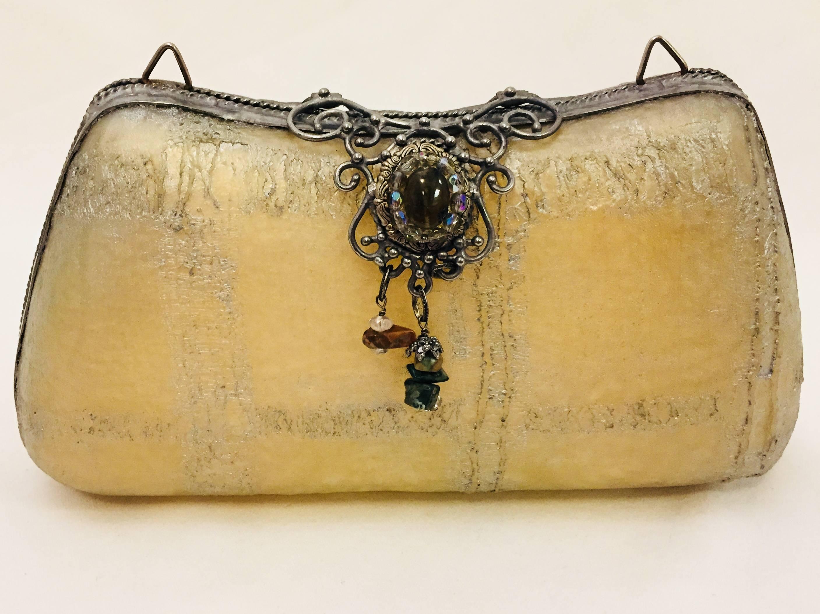 Maya handbags begun in 1985 by her and her daughter with a dream.  Maya highlights sculpted resin echoing natural forms, textures and colors. Coordinating pieces carry a distinctive quality with intermingling elements: semiprecious stones,