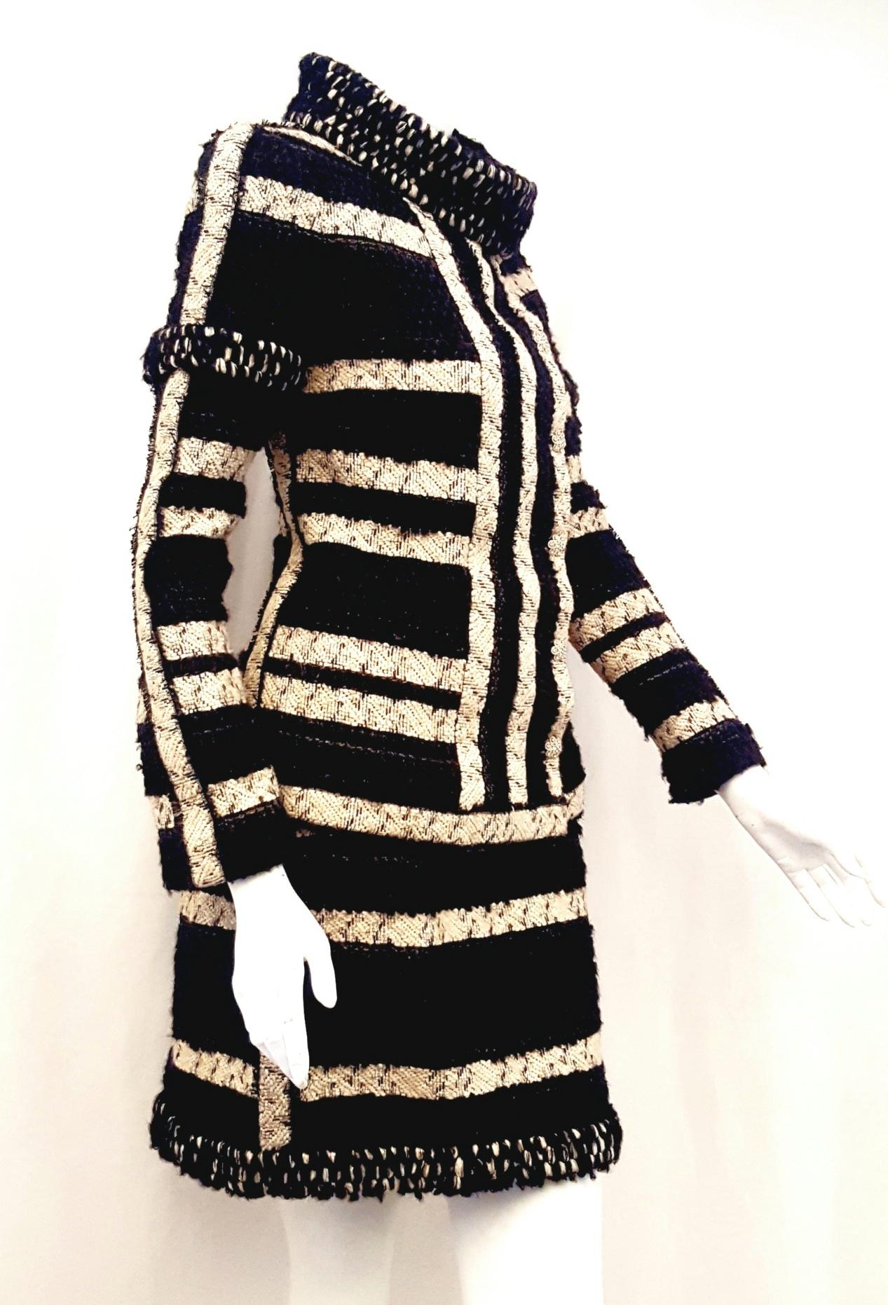 Chanel black and beige stripe design suit contains metallic black and gold tone threads throughout and combined with the mohair it adds texture and glam to this Autumn 2009 ensemble.  This classic fantasy tweed suit has an amazing collar, the royal