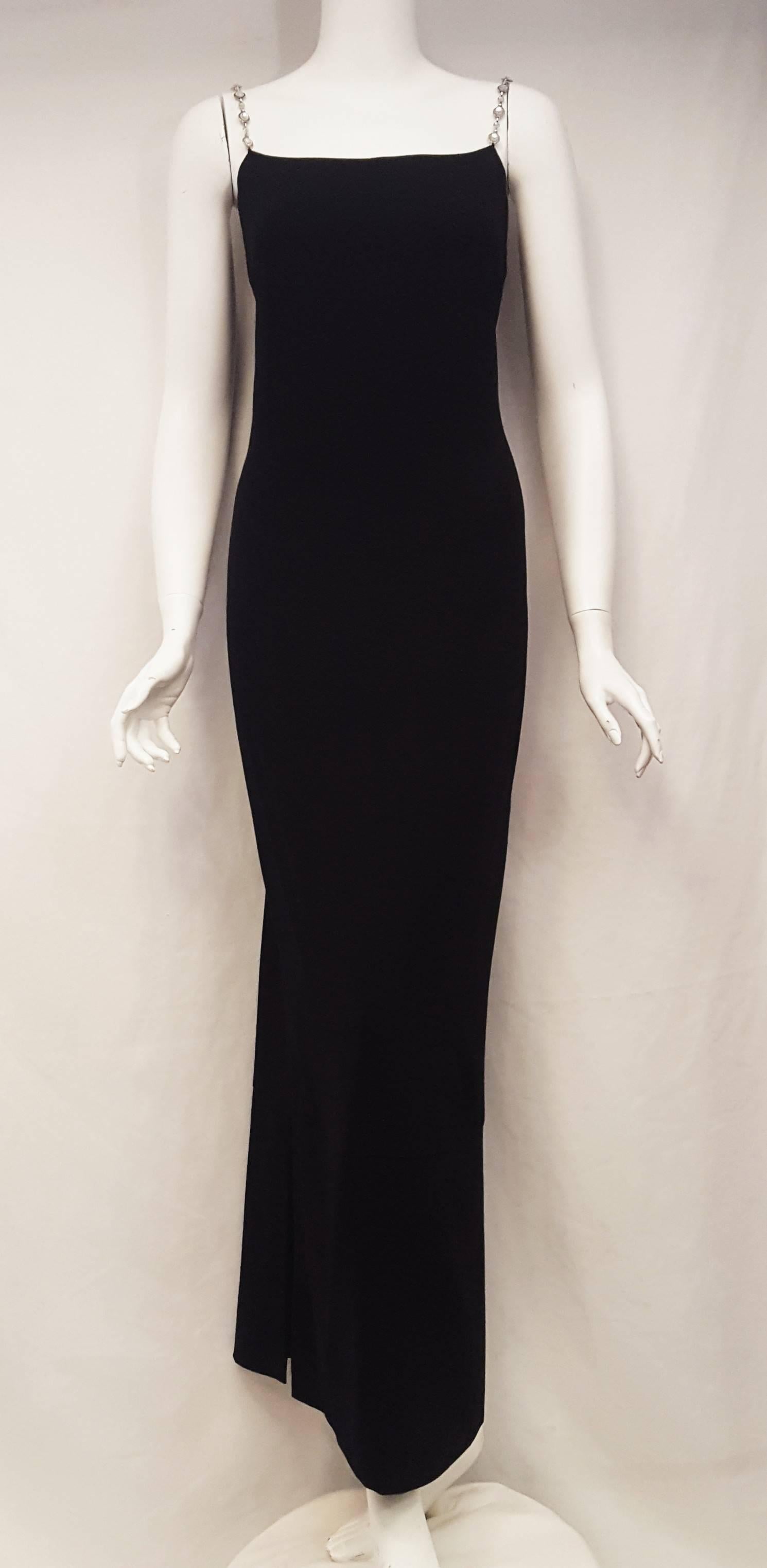Chanel black wool long dress with crystal gripoix straps makes a statement for many occasions!  It will stand out much more than your typical LBD.  The gripoix crystal is set in an elegant yet sturdy silver tone chain.  The hidden zipper is set to