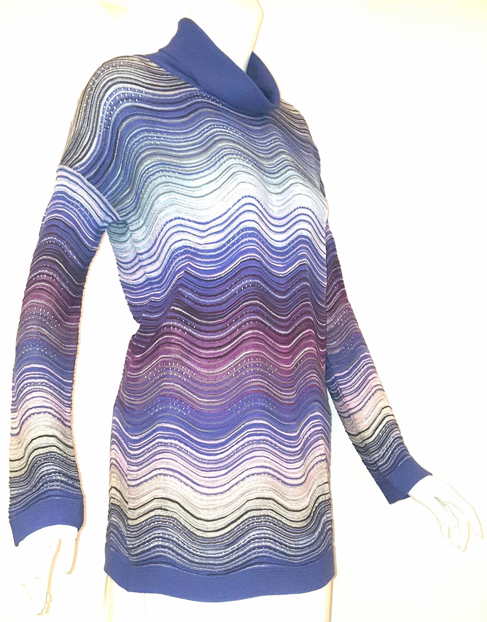 Missoni textured metallic knit is unabashedly feminine and celebrates a woman's natural curves.  Features dramatic horizontal ribbing on front and back.  Multicolor wave design stripes are striking in this turtleneck pullover with ribbed hem.  