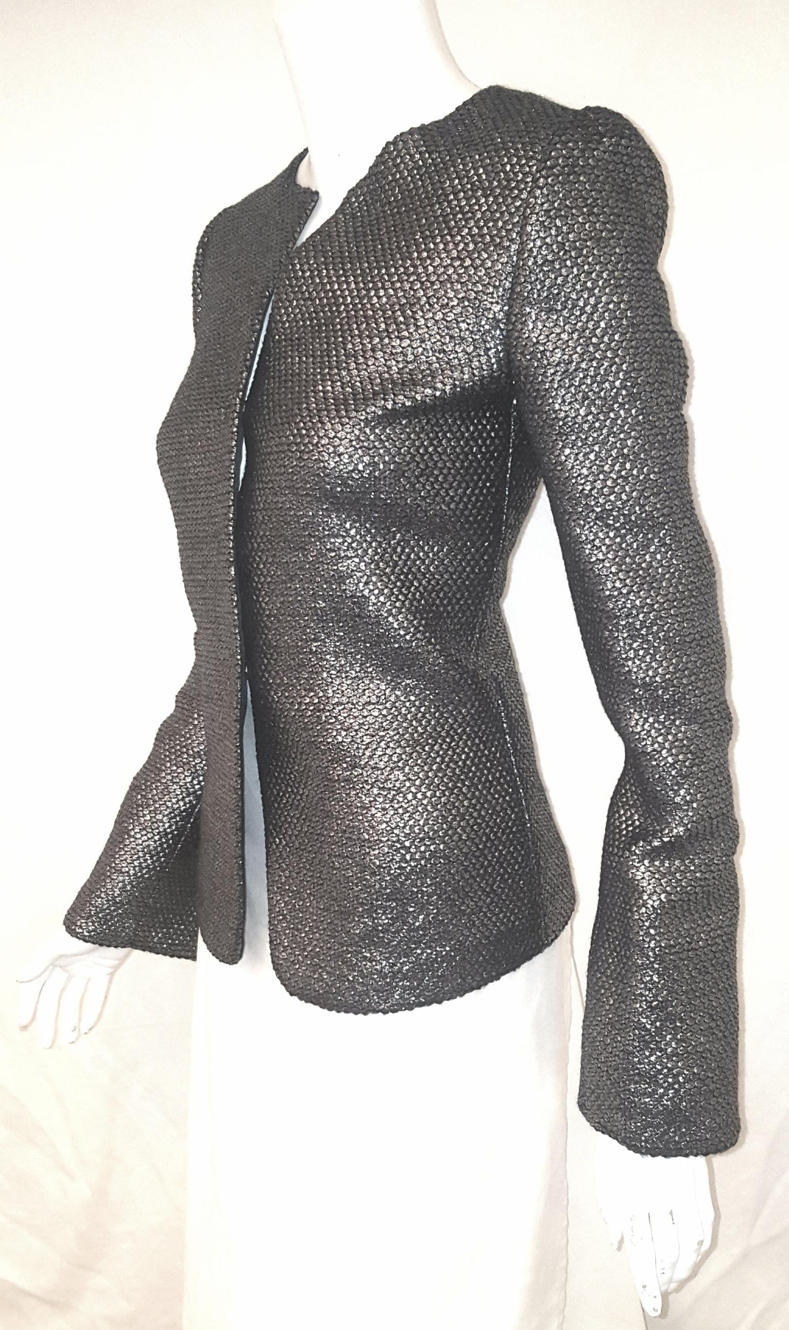 Armani Collezioni pewter tone honeycomb print brocade jacket can be worn with a LBD or with skinny pants.  This travel anywhere and anytime jacket is the perfect travel companion (wardrobe wise)!   This round neckline can be complemented with a