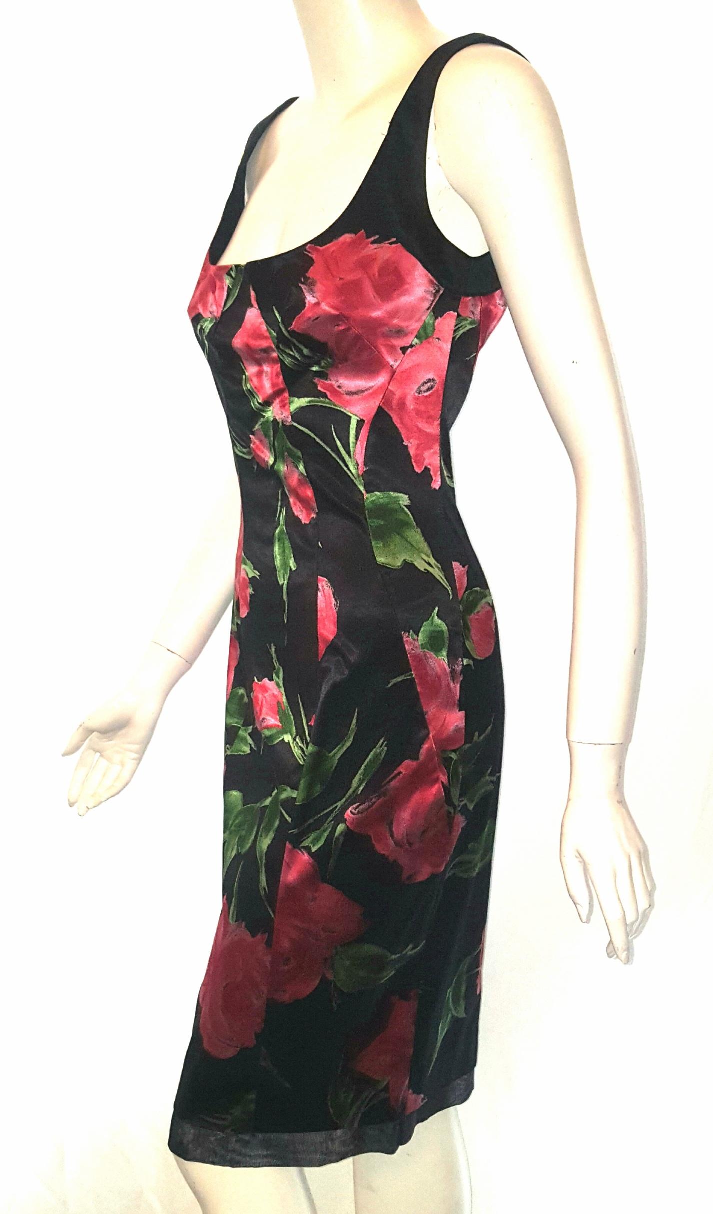 Only Under 40 by D&G (Dolce & Gabbana) black and red stretchy satin sleeveless dress contains a zipper at back for closure and a single vent, also, at back.   The front  & back include curved darts from bustline to the hem and from the waistline to