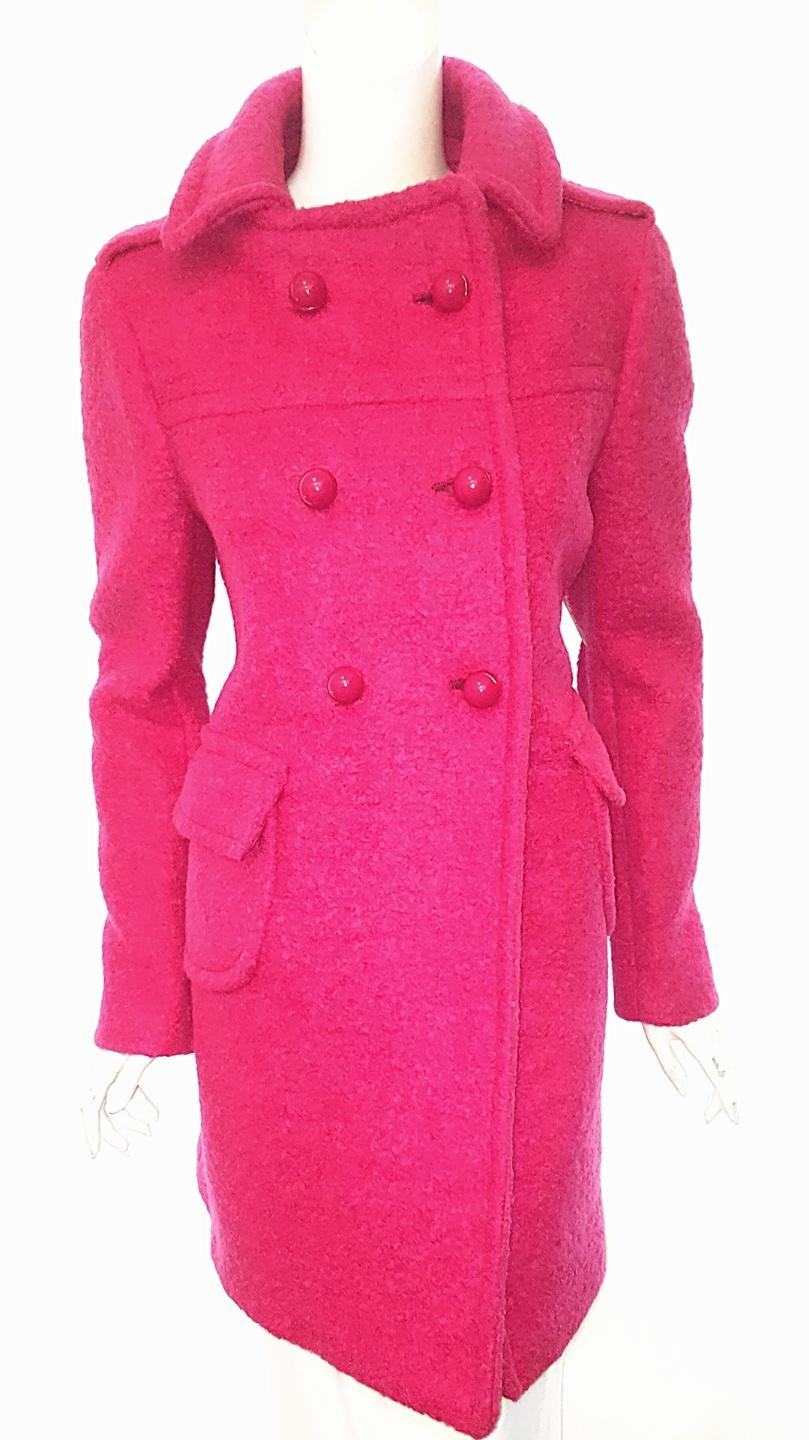 Prada's luxe wool and mohair jacket is a masterpiece in simplicity and cut for a timeless boxy shape.   This vivid Fuschia color makes even the coldest and gloomiest day bright again!   This double-breasted design features two patch pockets and 6