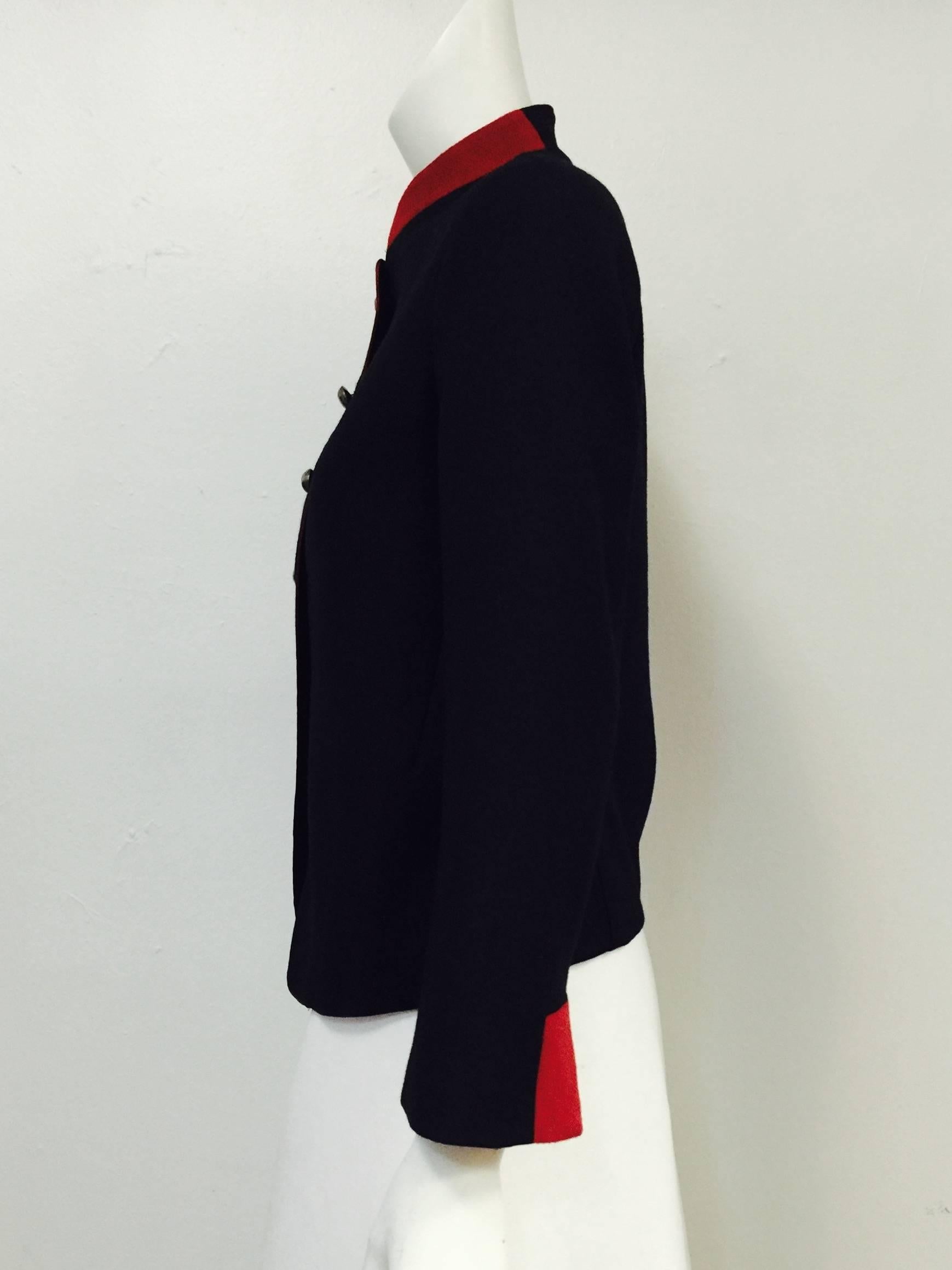 Nili Lotan Jacket Black Jacket pays homage to the military!  Features, luxurious wool and cashmere blend fabric, contrasting red Nehru collar, piping, and sleeve cuff accents and hammered silver tone buttons.  Fully lined.  Sleeve lining crafted