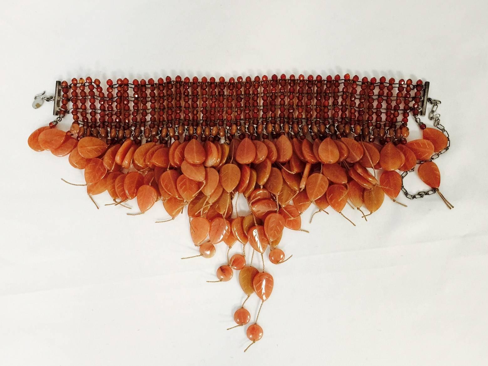 Captivating Choker features 8 strands of multi-faceted carnelian gemstones and several engraved 