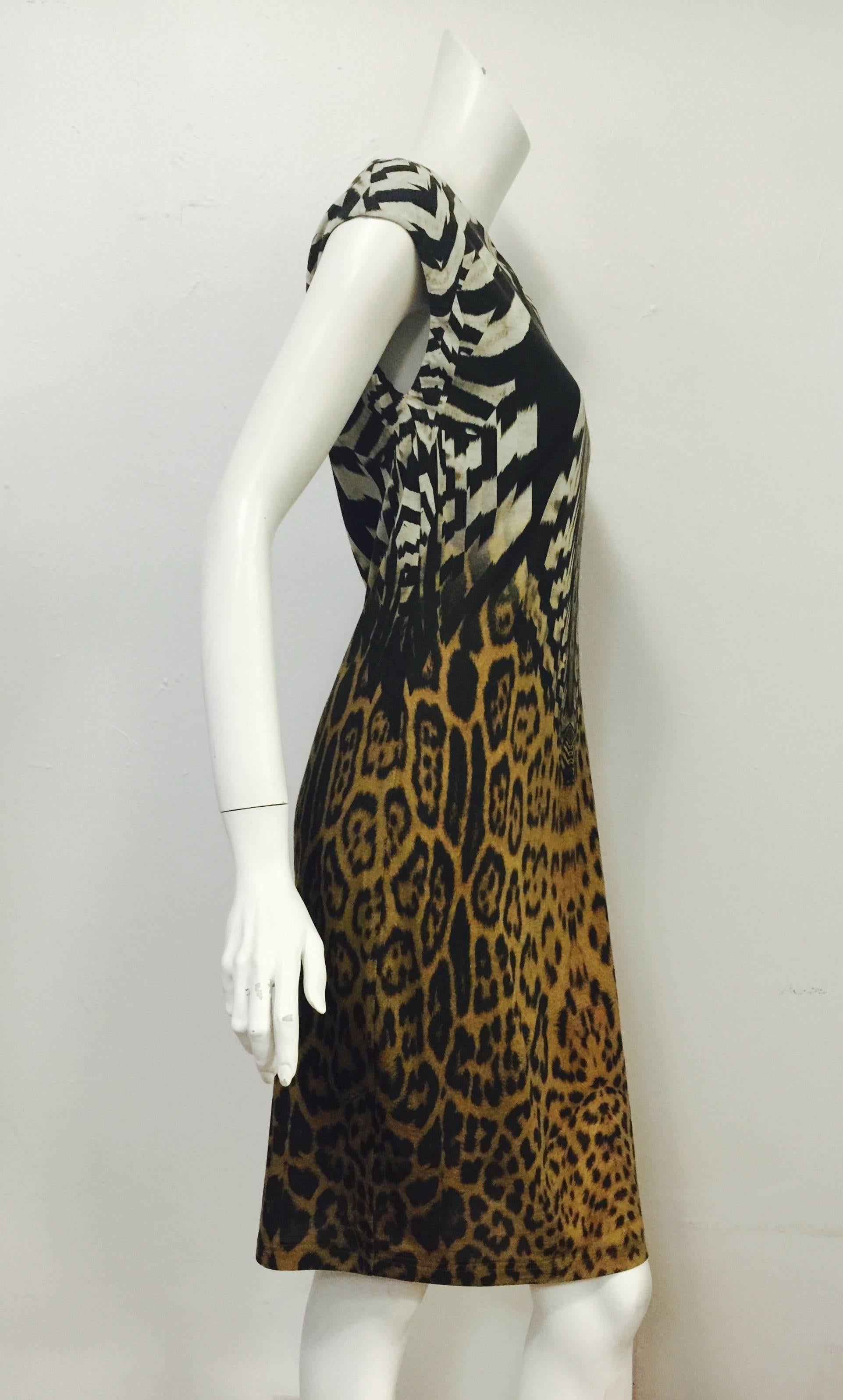 Wool Blend Sheath With Cap Sleeves is typical Cavalli...feminine, body conscious, and just a little wild!  Features luxurious wool blend fabric with just the right amount of stretch in an unforgettable leopard print.  Primary print is complemented