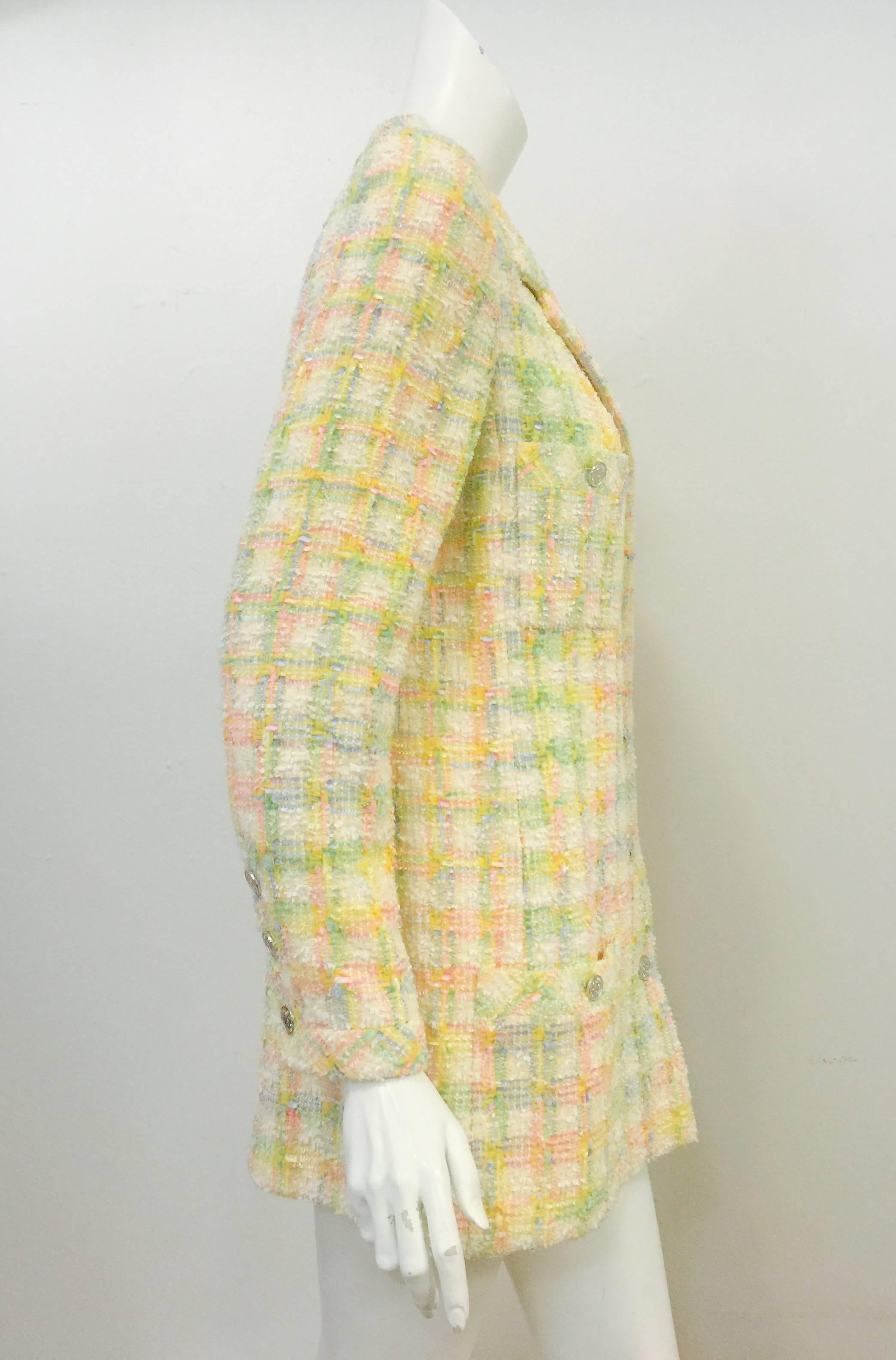 Pastel colors never looked so yummy as when combined in this spectacular ode to Chanel!  Primarily sunburst yellow, cornflower blue, and petal pink, Chanel Wool Blend Tweed Jacket features comfortable, yet long and tailored silhouette.  Front has