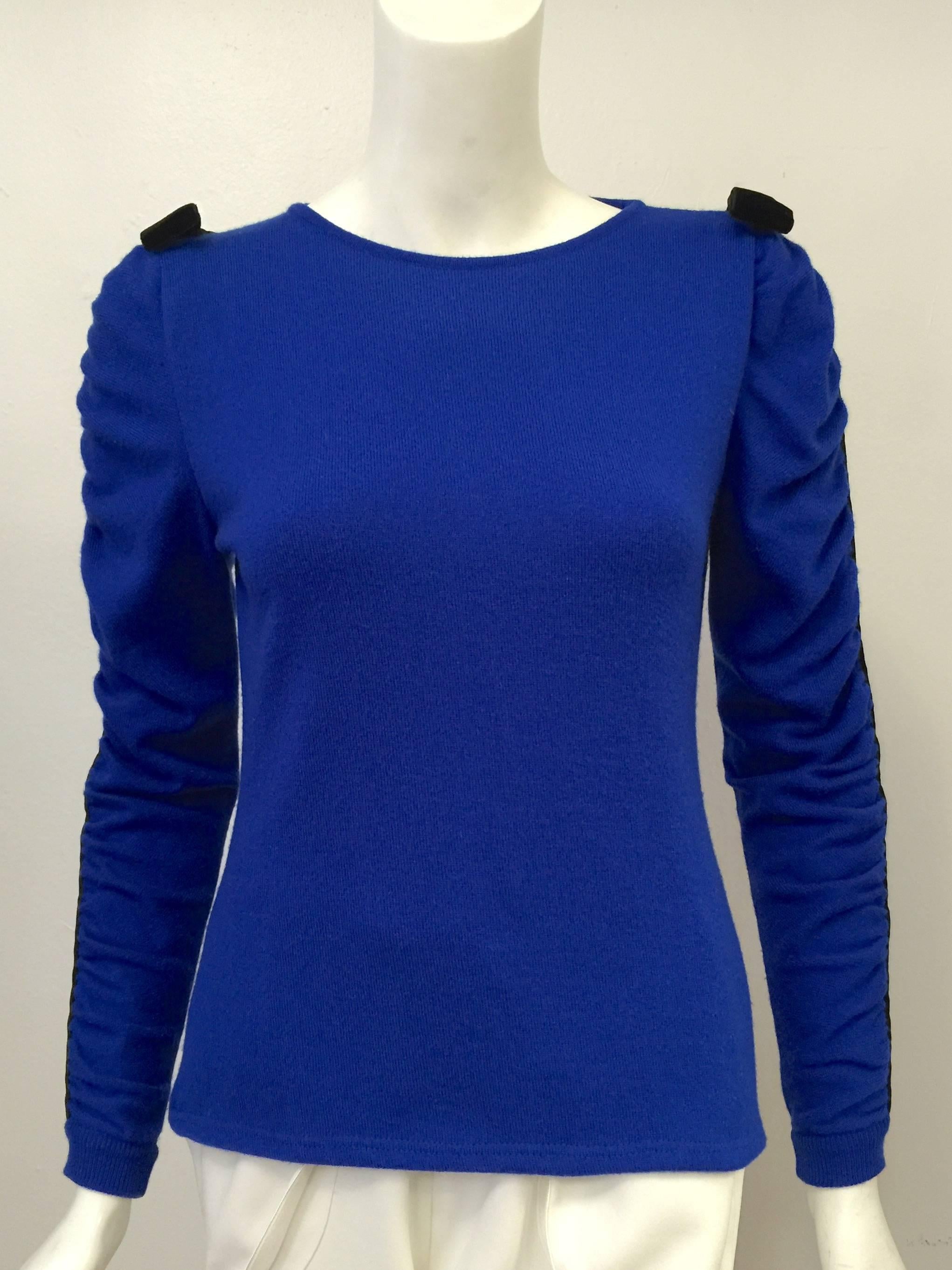 Valentino Boutique Royal Blue Pullover is typical Valentino Garavani...classic, feminine, and luxurious!  Features fine wool in a glorious shade of royal blue, round neck, and long sleeves.  With a nod to Valentino's couture house, sleeves have been