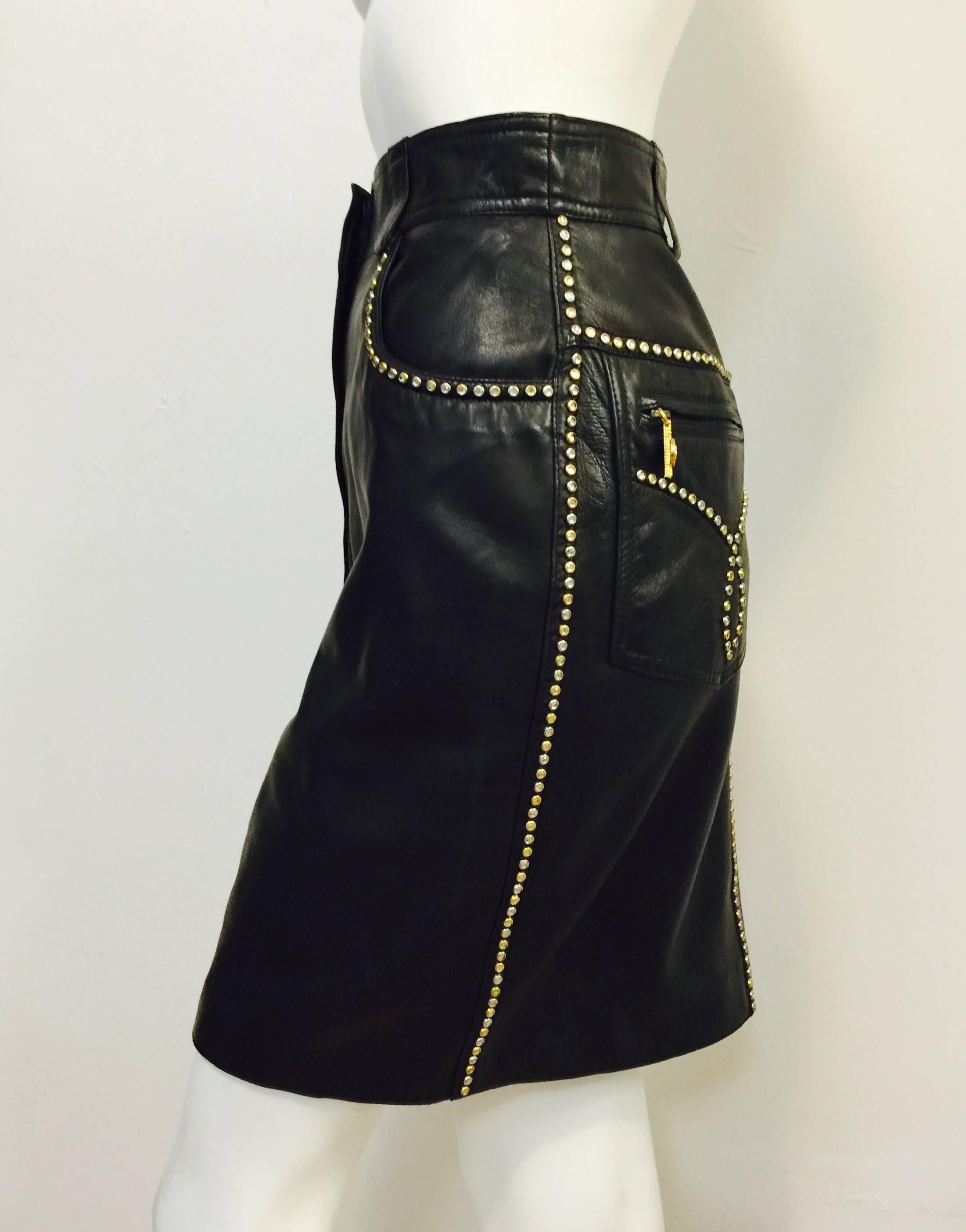 1990s Versace Studded Lambskin Straight Skirt is quintessential Gianni!  Features ultra-luxurious leather and styling that takes cues from 5-pocket denim jeans.  Zippered welt rear pockets have crystal encrusted gold tone pulls.  4 belt loop banded