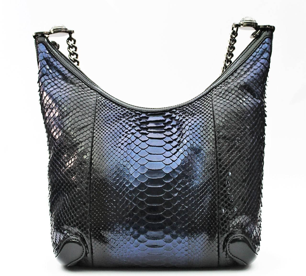 Gucci python navy blue bag with thick gunmetal chain. The bag is lined with smooth lambskin leather. Ends of the chain feature round gunmetal charm with GG.