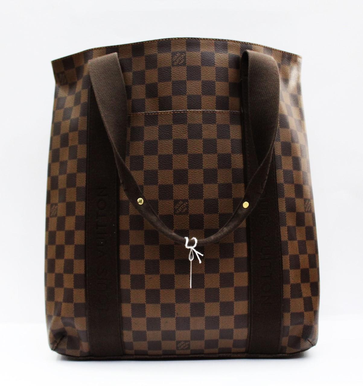 The Louis Vuitton Damier Canvas Beaubourg Tote Bag has fashion and functionality all rolled into one. It features press studs on both sides for expanding the bag to fit a laptop or larger documents. With its roomy capacity, it is perfect for taking