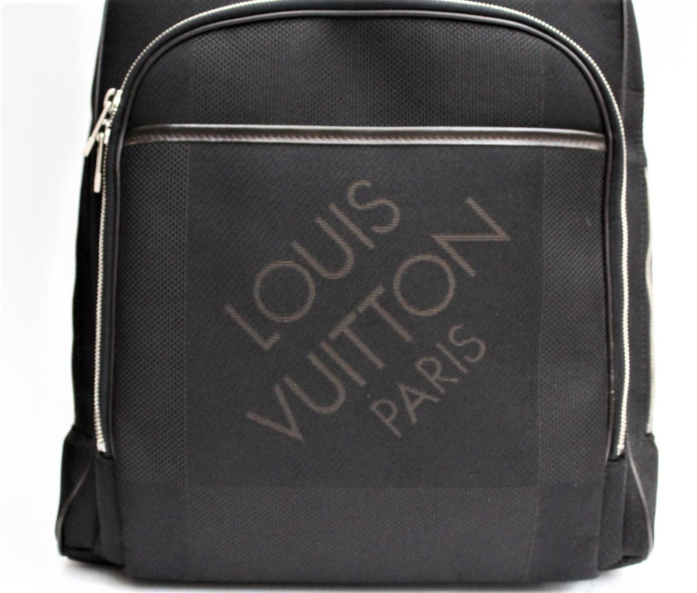 The Louis Vuitton Black Damier Geant Bongo Backpack Bag is great for ultimate hands-free convenience. This backpack is a look that combines classic Louis Vuitton design cues with the latest in high tech materials. This sleek bag offers ample