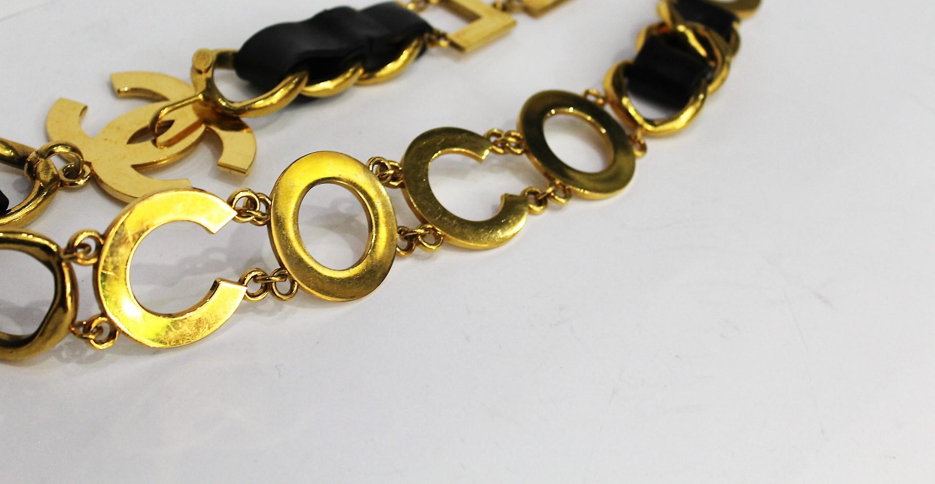 Authentic Chanel chain belt in black leather and gold tone.