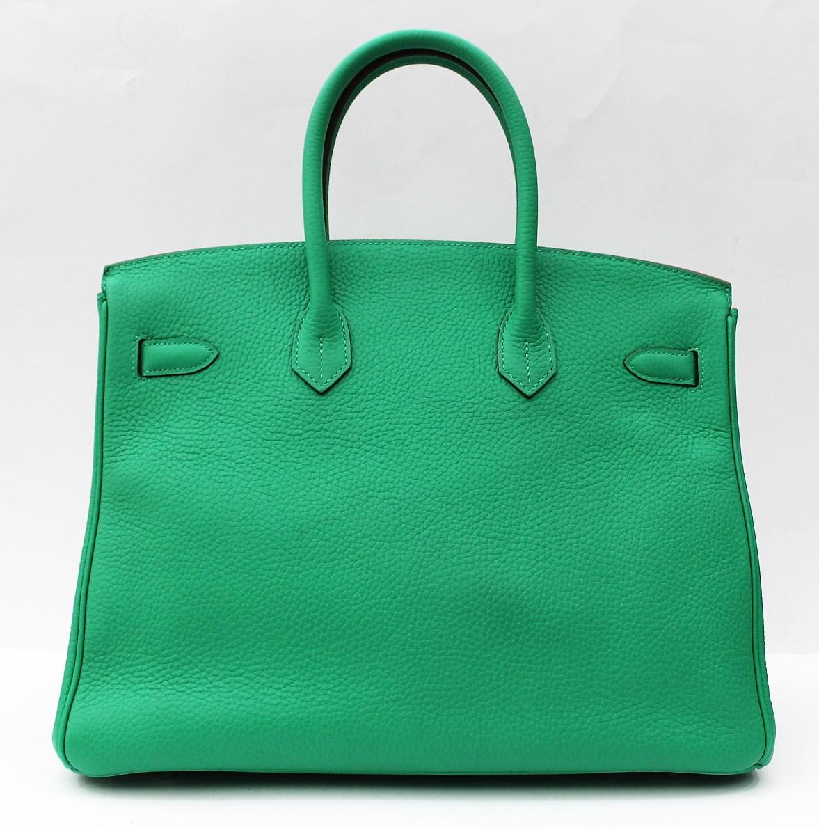Birkin 35 in Menthe Green. Crafted in spectacular Taurillon Clemence Leather, this exceptional piece is in a beautiful shade of bright Mint Green accentuated with a Silver Palladium Hardware.
Protective plastics
Year 2012 
Original Dustbag