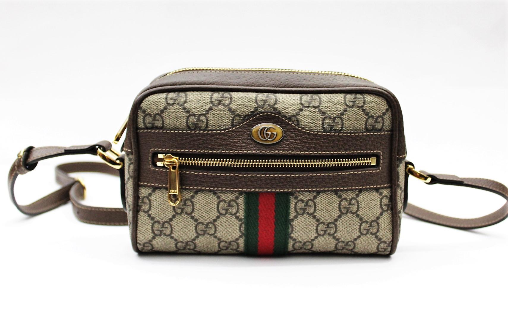 From the actual collection of Gucci there is this beautiful mini bag.  
Gucci ophidia crossbody bag , 70s style, with adjustable shoulder strap and zip closure.Color beige and ebony with green and red web detail. Made with classic canvas of Gucci ,