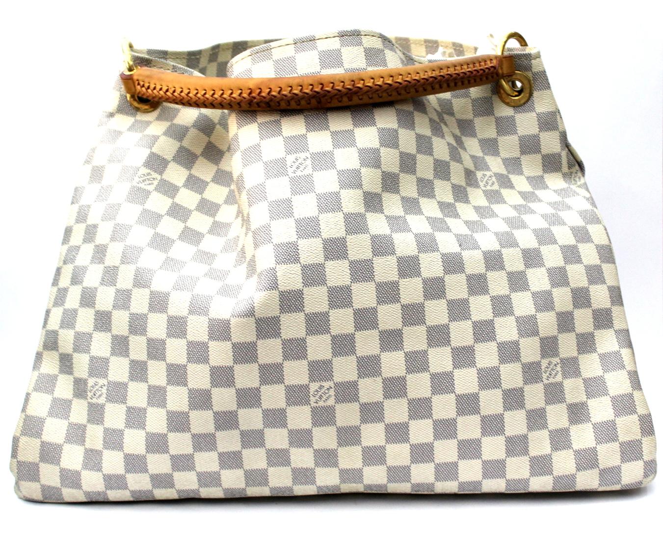 The Louis Vuitton Damier Azur Canvas Artsy GM Bag has a unique and modern structure. This roomy tote makes a perfect work or weekend bag, large enough to hold all your essentials in style. It features a detachable stylish Louis Vuitton key ring for