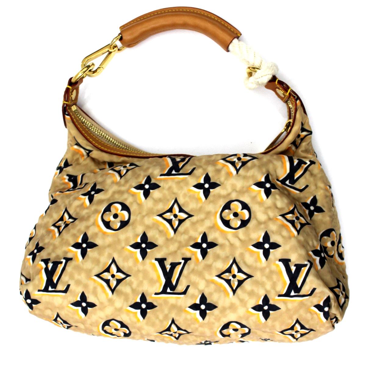 The Louis Vuitton Limited Edition Navy Nylon PM bag is an extraordinary creation. Marc Jacobs chose to reinterpret the LV Monogram with a triple printed pattern on textured nylon. This beautiful model is combined with caramel-colored leather and