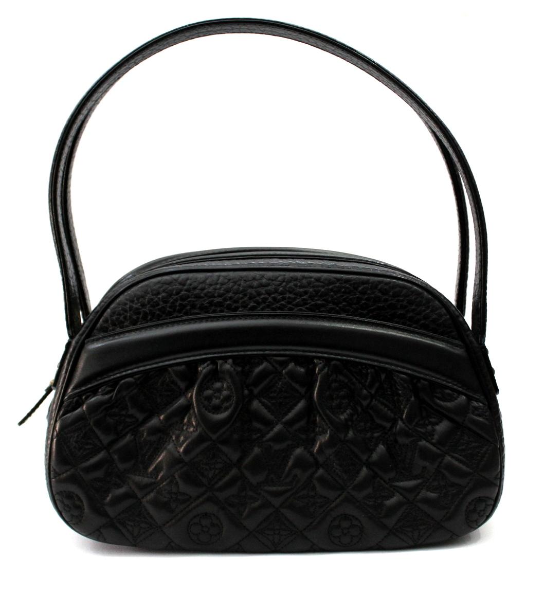 Don't miss out on your opportunity to own this rare and limited edition Louis Vuitton Limited Edition Black Monogram Klara Vienna Bag. It features gorgeous black quilted lambskin leather meticulously embroidered to reveal the Monogram pattern and