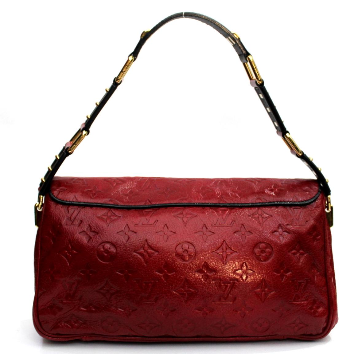 From the Fall Winter 2009 2010 this beautiful bag. It is the Monogram My Deer Collection. The actual material used is deer skin embossed with the famous monogram flowers. The color used : red, deep blue and gold hardware. Very good condition. Retail
