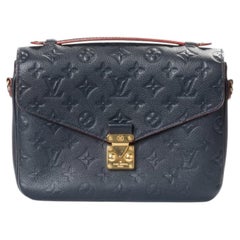 Louis Vuitton Metis MM Empreinte Clutch in Blue