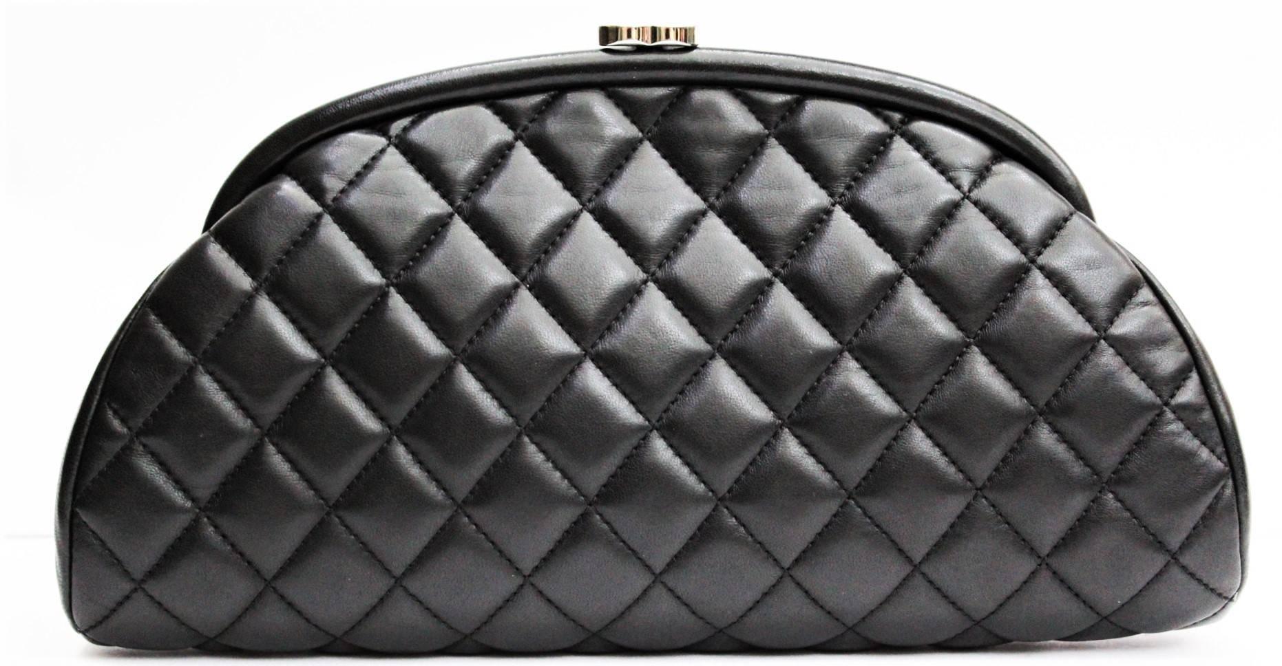 We guarantee this is an authentic CHANEL Lambskin Quilted Timeless Clutch Black or 100% of your money back. This stunning clutch is beautifully crafted of black diamond quilted lambskin leather. The clutch features a top bar and kiss lock in the