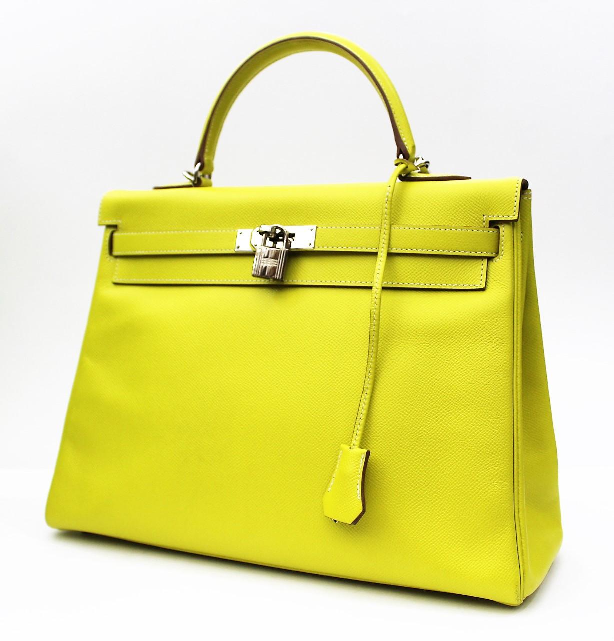 This limited edition Birkin Hermès bag is featured in the Candy Series Lime color, which is incredibly rare. The interior is featured in Gris, which is a gray tone and is accented by hardware in palladium. This exclusive collector's item is made of