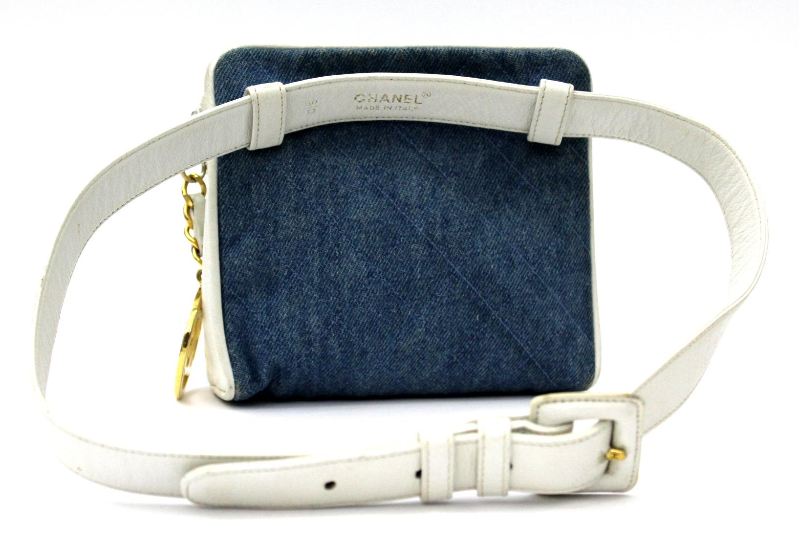 Vintage belt bag from Chanel archives. It is made with white leather and denim fabric. The size of belt is 80 cm. Zip clousure with gold big logo details Chanel . It is an item for real collectors.