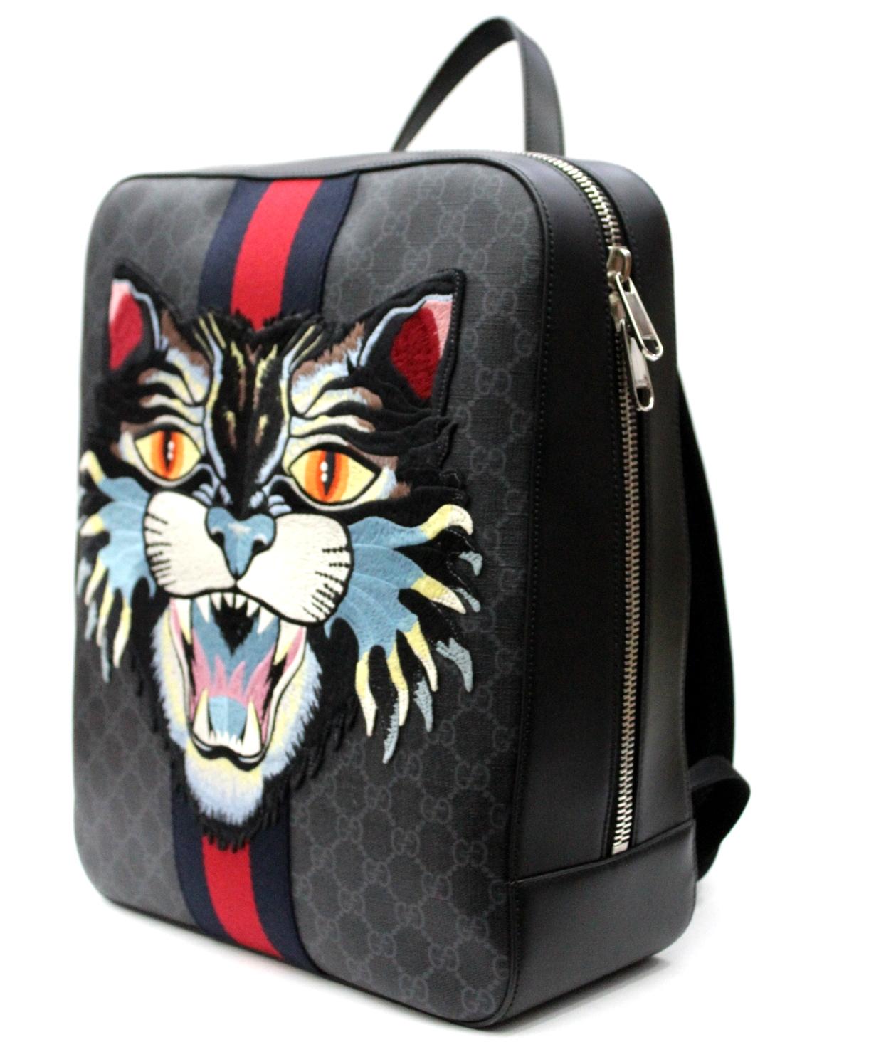 The snarling cat head is embroidered and applied to a structured backpack made in GG Supreme canvas with Web stripe.
Black/grey GG Supreme canvas, a material with low environmental impact, with black leather trim
Palladium-toned hardware
Blue and