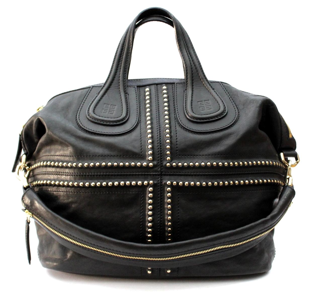 Beautiful bag Givenchy model Nightingale. It is made in black leather and embellished with studs. The Nightingale bag features two soft leather top handles, comes with the Givenchy signature emblem logo stamped at the base of each handle and the
