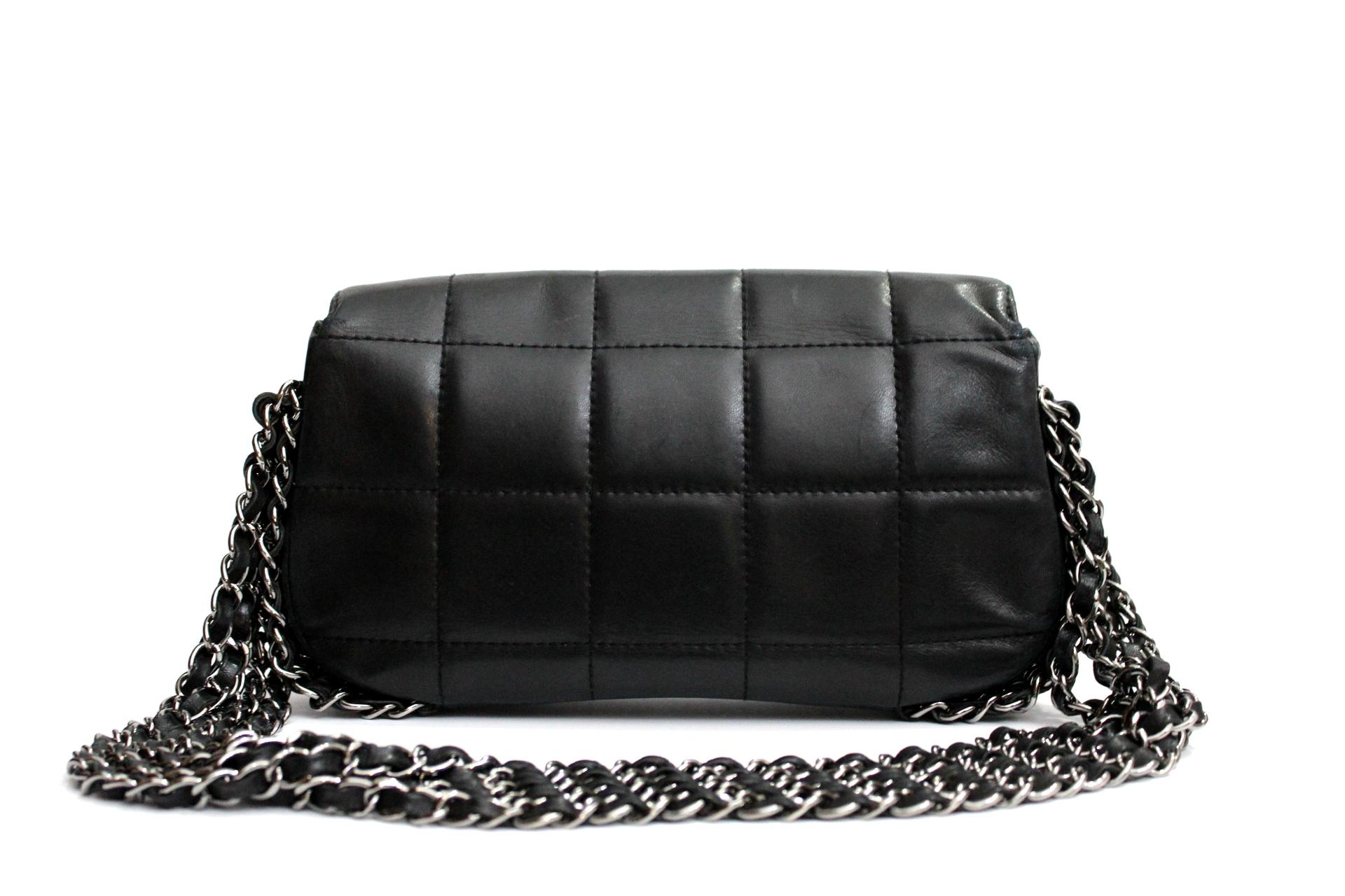 Black leather and cotton multiple chain logo shoulder bag from Chanel Vintage featuring a flip-lock closure, a quilted effect, a silver tone logo, a chain strap and internal pockets
Very soft black lambskin. Wearable on the shoulder.
The bag is in