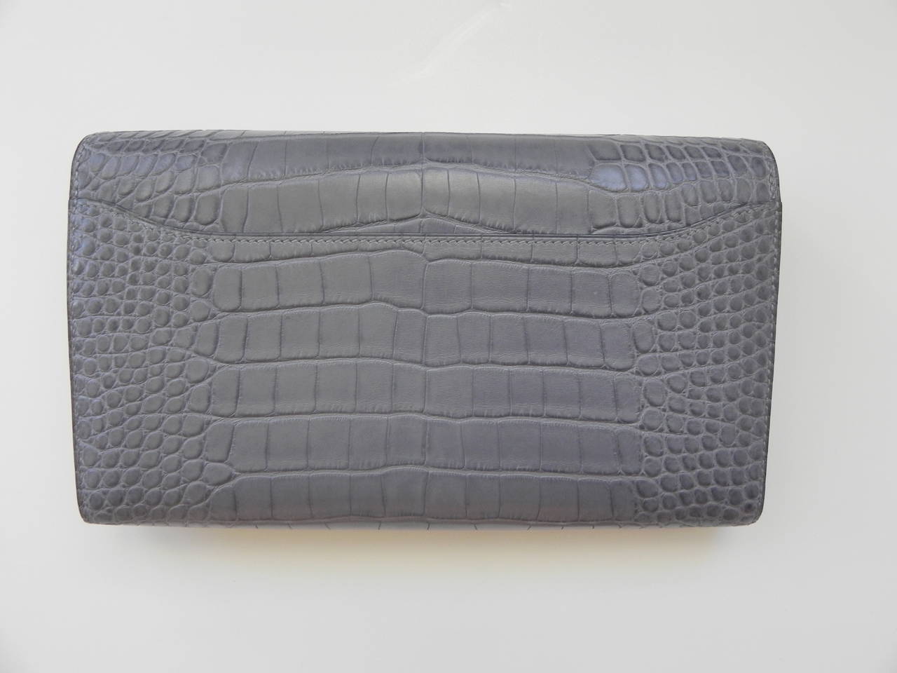 Hermes Alligator Mississippi Gray Constance wallet clutch .

Color :8M GRIS PARIS

Excellent condition with the original Price tag and description .Hermes Box.

Hermes Cites permit :Palladium Hardware 

Circa :2011    O Square year