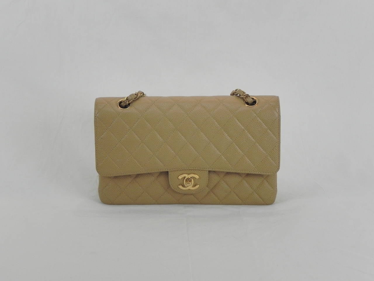 Chanel Classic Caviar 25.5 Beige Party Bag .
Circa 2003-2004 in Pristine Condition .
Interior and Exterior is Flawless and the perfect bag for Spring ,Summer & Fall !!
Dimensions are 10 L x 3w x 7 H Shoulder drop 15 inches .
Comes with the