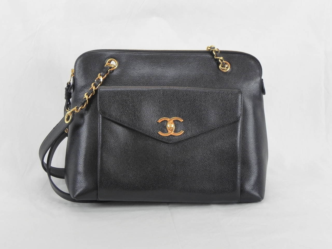 Chanel Black Caviar Shoulder Bag Vintage bag with Front Pocket 
Very Good Condition .Circa 1996 .Serial Number 3698xxx with Chanel Guarantee card .Dimensions :16 x 5 x 10.5 Inches .Zippered Bag down the Center .Great durable bag which will last
