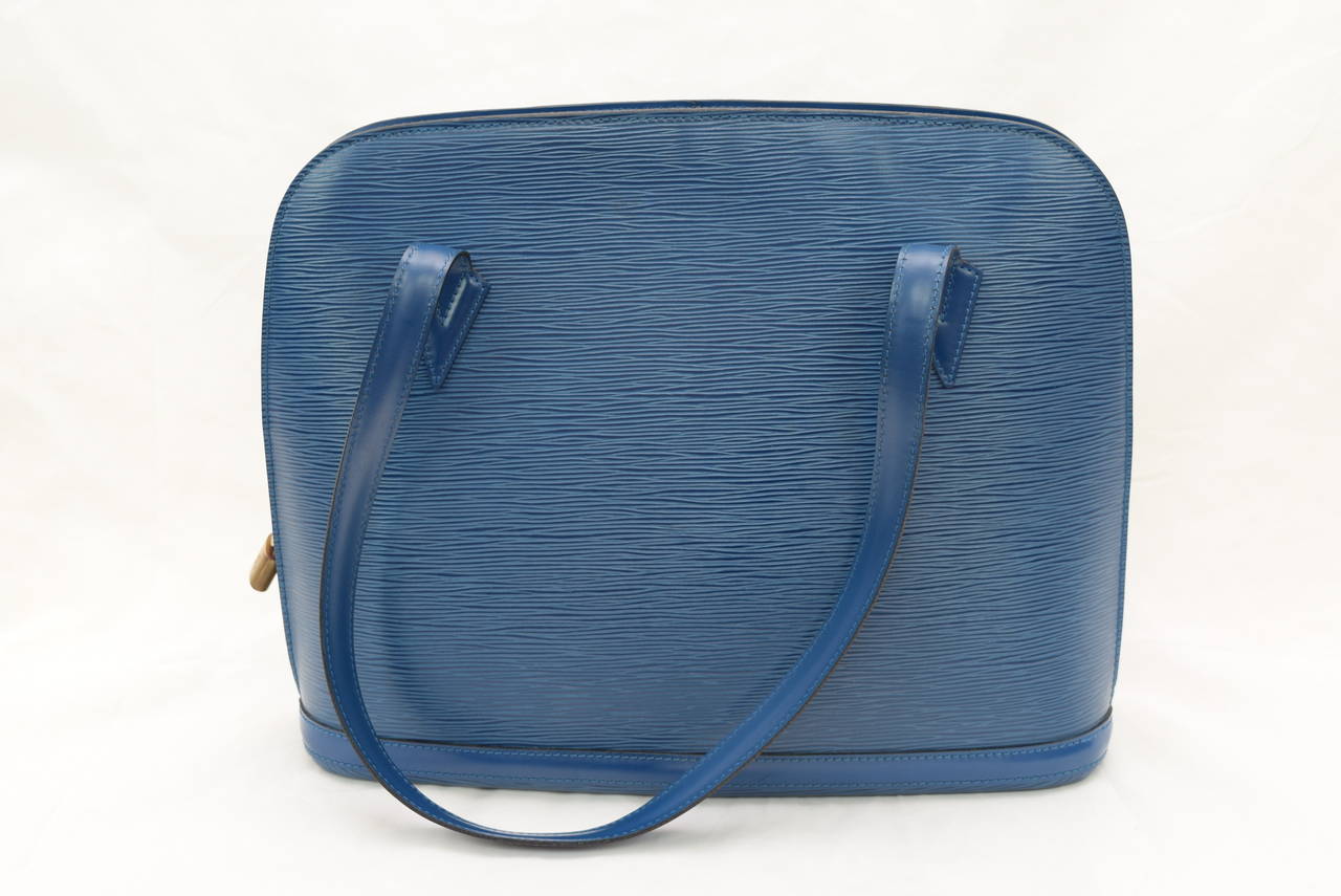 Louis Vuitton Epi Blue Lussac Shoulder Bag .Discontinued Model 
Circa 2005 :LV Code Year:VI 0935.Manufactured in March ,1995.
The interior and exterior are in Very good condition .One small spot only on the inside of the bag about 1 cm in