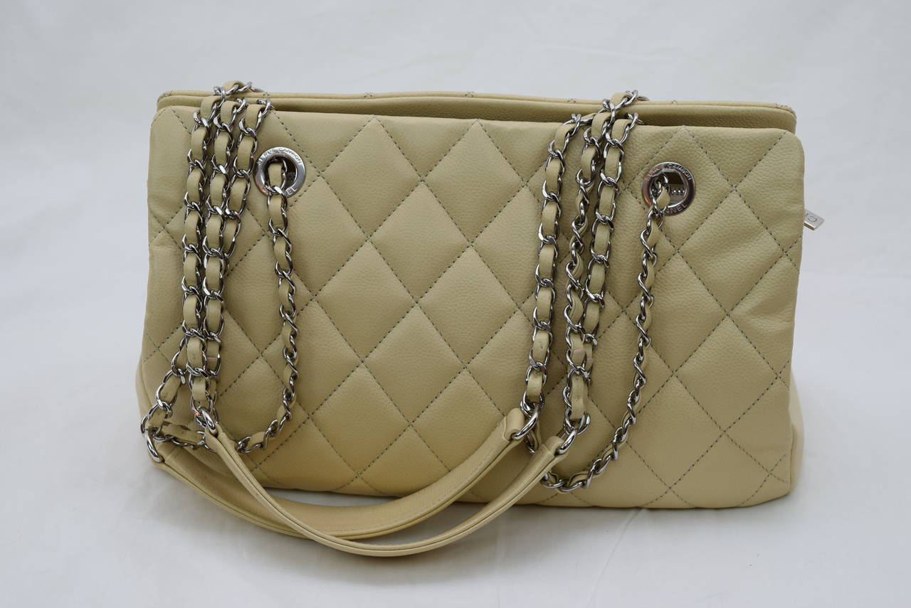 Chanel Cabiaskin Beige Shoulder Bag with Palladium Hardware .Circa :2012 
Mint condition bag .Looks like New !!! 
Comes with Chanel guarantee card ,Dust Bag and Box !
Serial 1573386
Dimensions :12.5 x 5.0 x 8.5 inches .
Great Spring and Summer