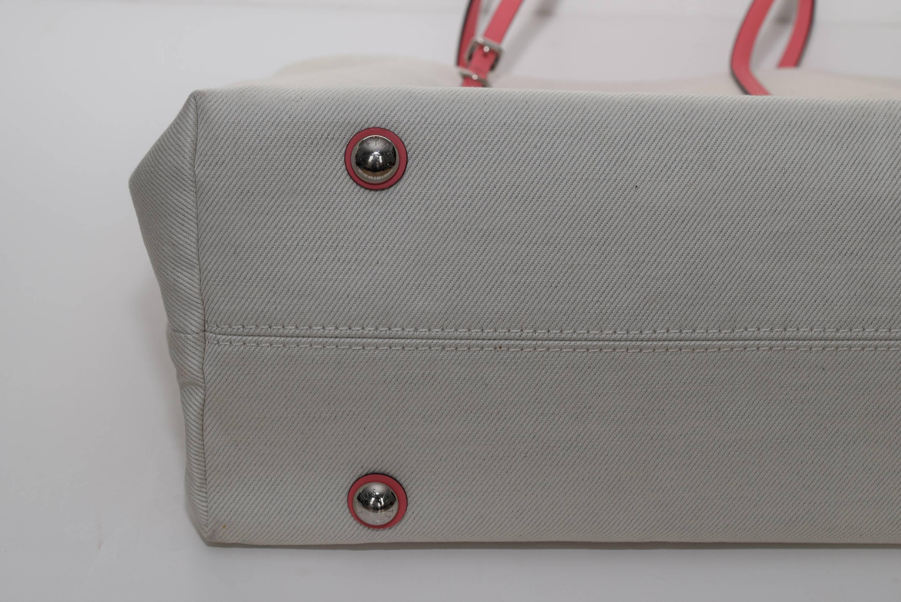 This adorable tote is perfect for your resort getaway or carry this Articles de Voyage shoulder bag all summer long. Composed of a durable cotton canvas with chic coral leather trimming and the Louis Vuitton 'Articles de Voyage, 101, Champs Elysees