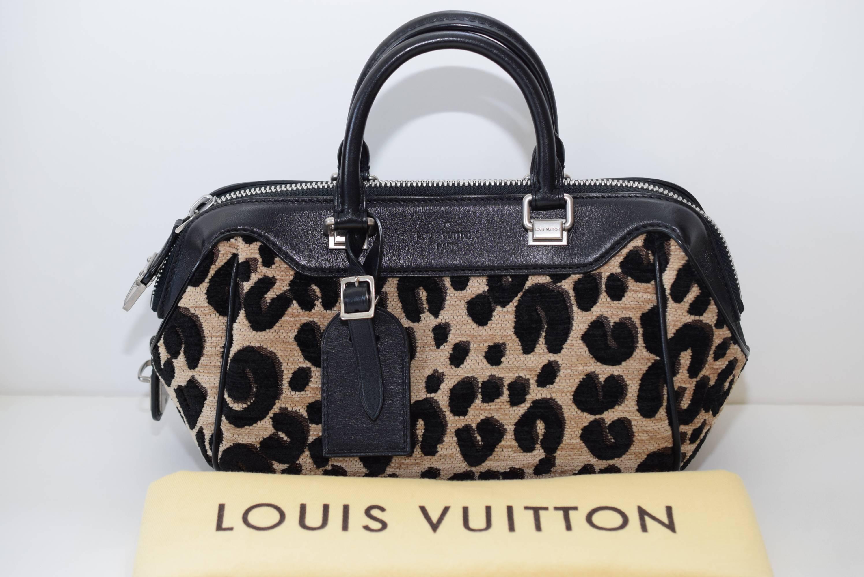 Limited Edition Spouse Print Baby Leopard Bag. Features silver tone hardware, smooth black leather trim and accents with a 4