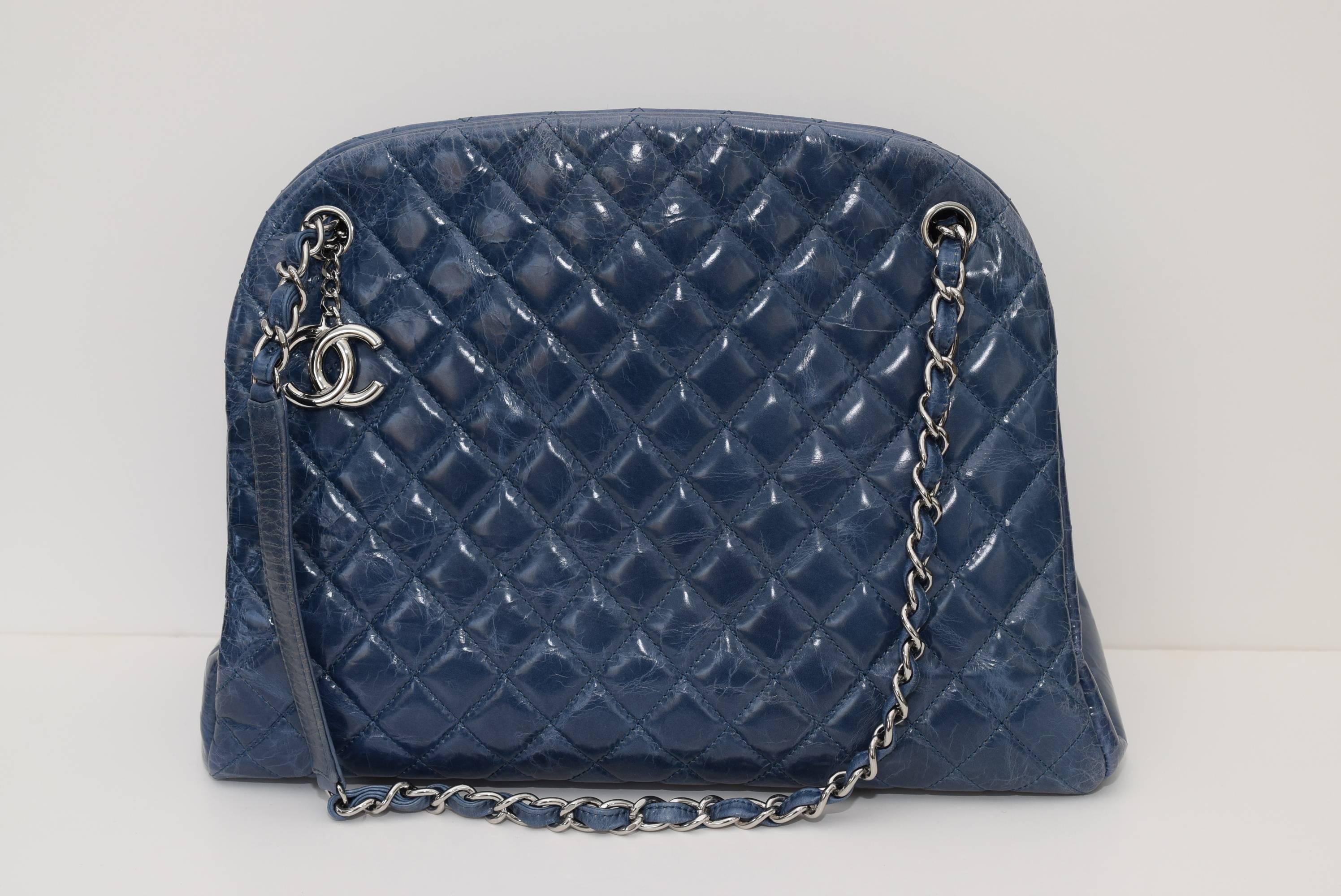 This is an authentic CHANEL Caviar Quilted Large Just Mademoiselle Bowling Bag in Blue. This chic bowling bag style shoulder bag is crafted of diamond-quilted caviar leather. The bag features leather-threaded silver chain-link shoulder straps and a
