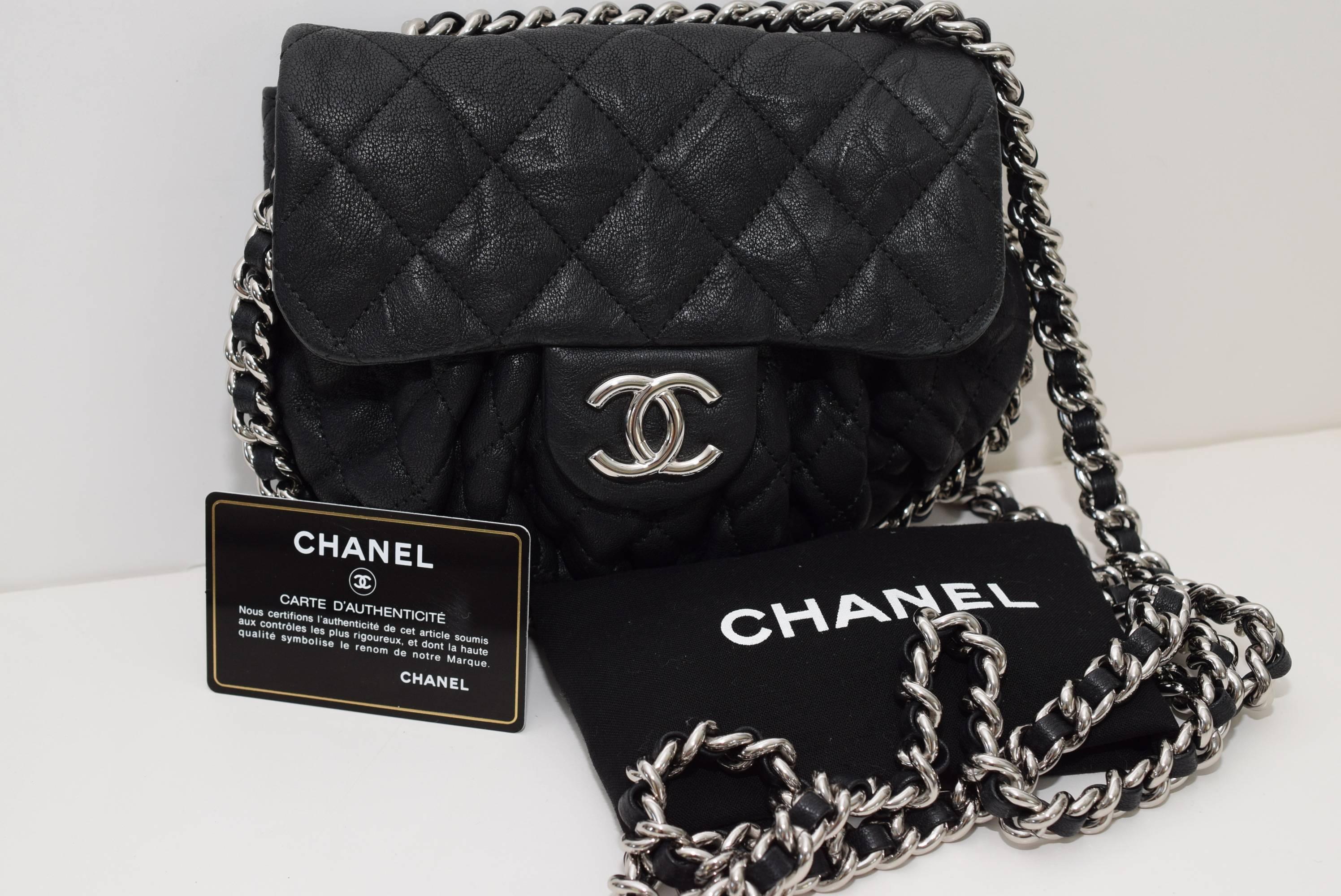 Black This is an authentic CHANEL Washed Lambskin Quilted small Chain Around Messenger