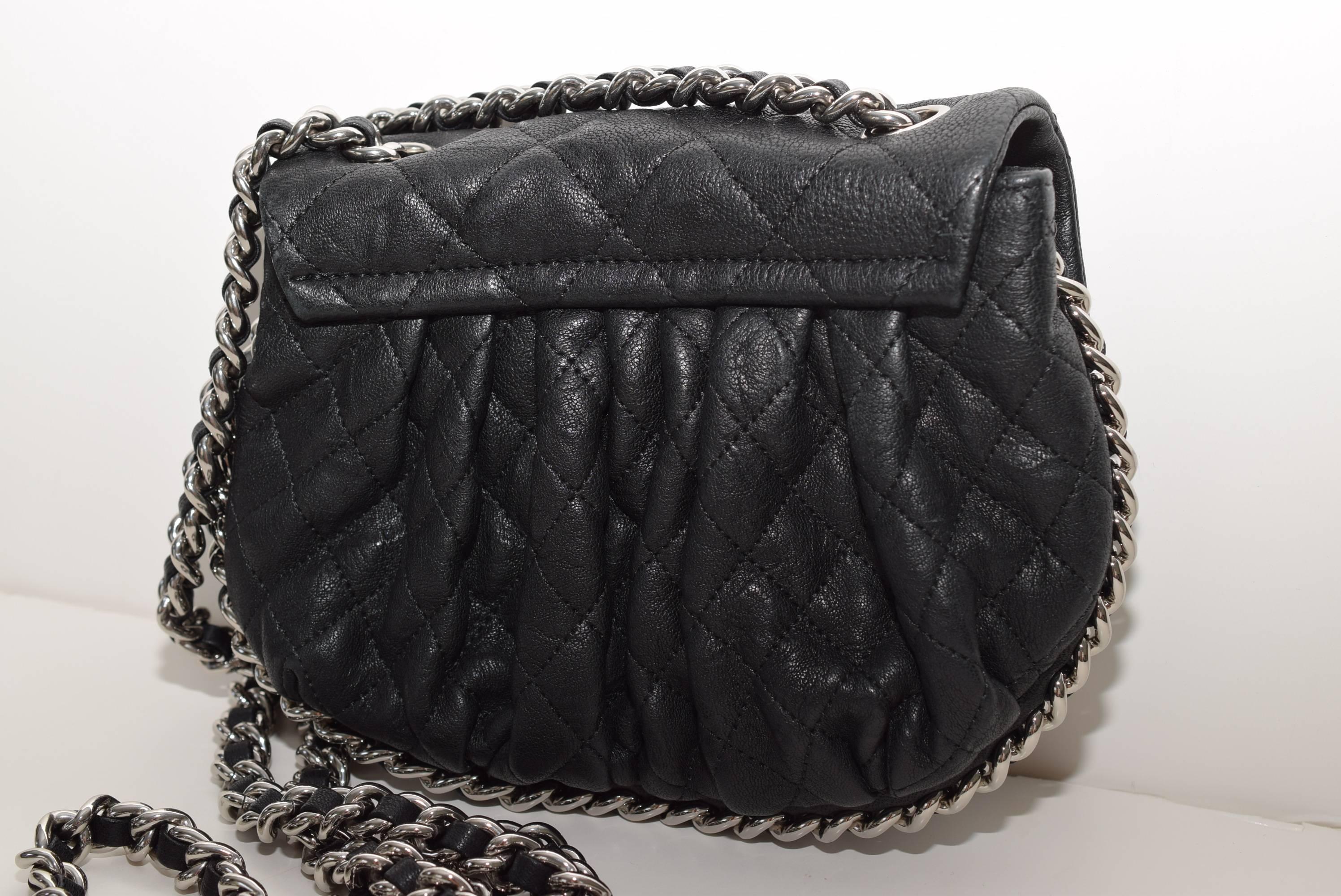 This is an authentic CHANEL Washed Lambskin Quilted small Chain Around Messenger 2