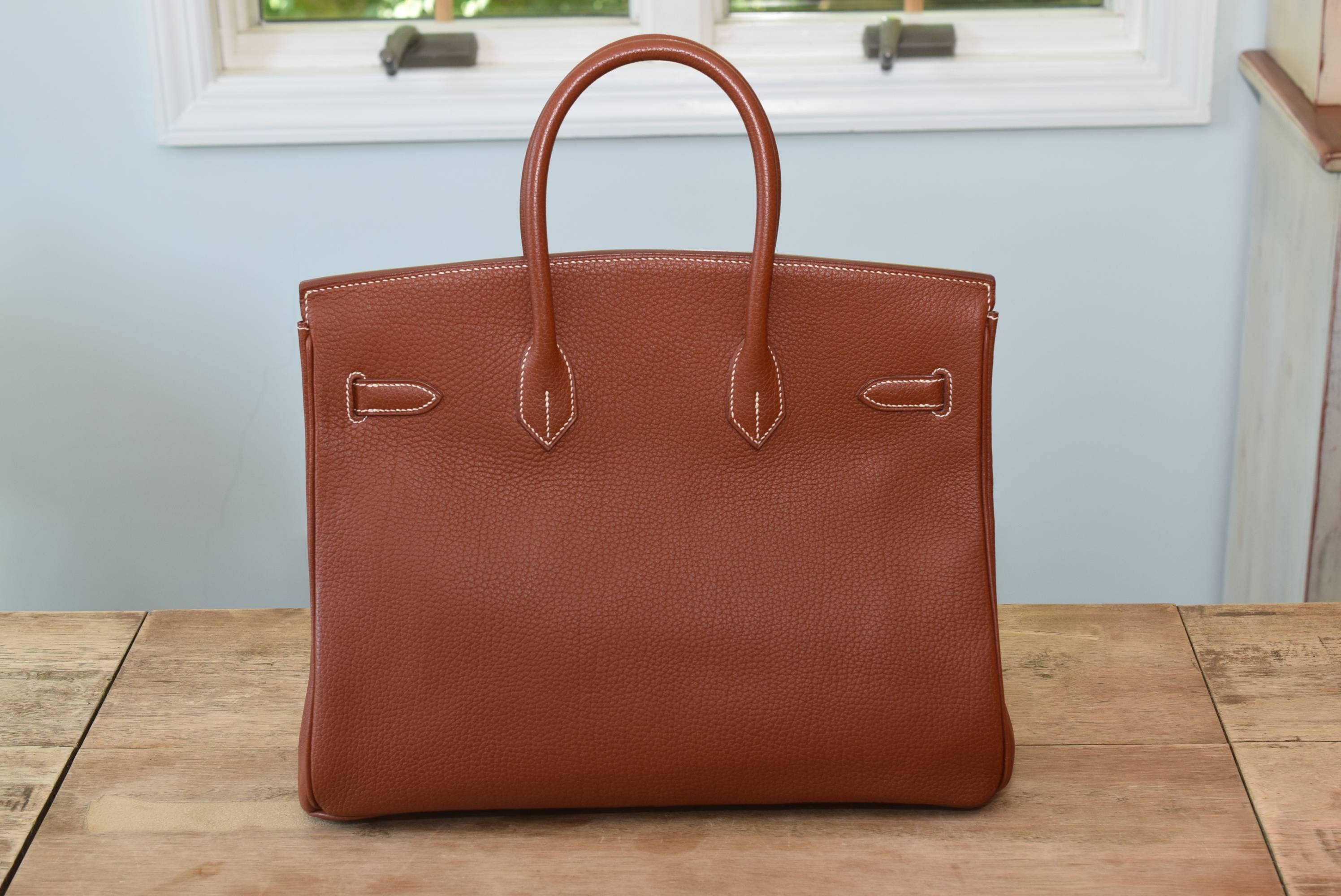 Hermes Togo Birkin 35cm in beautiful Noisette Brown.  Perfect color for every season! This Birkin is in excellent condition with minor wear on the corners and faint scratches on the gold hardware (which can be polished out).  Inside is very clean. 