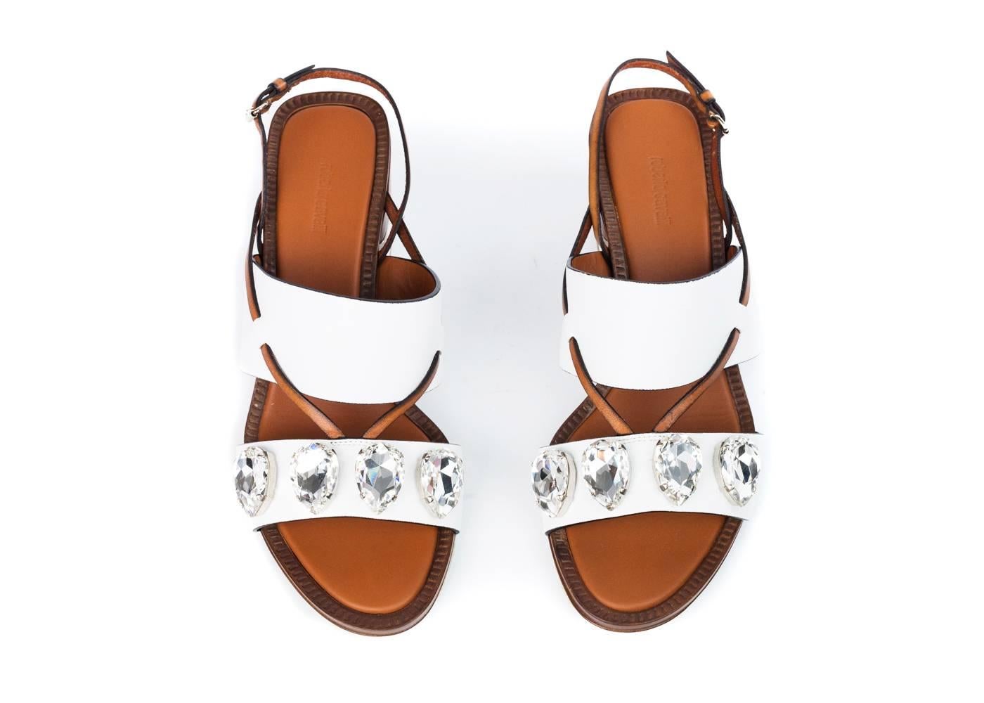 rand New Roberto Cavalli Sandals
Original Box & Dust Bag Included
Retails in Stores & Online for $1120
Size IT 38 / US 8 Fits True to Size

White leather Roberto Cavalli  sandals feature buckle ankle strap closure, crystal embellishments and block