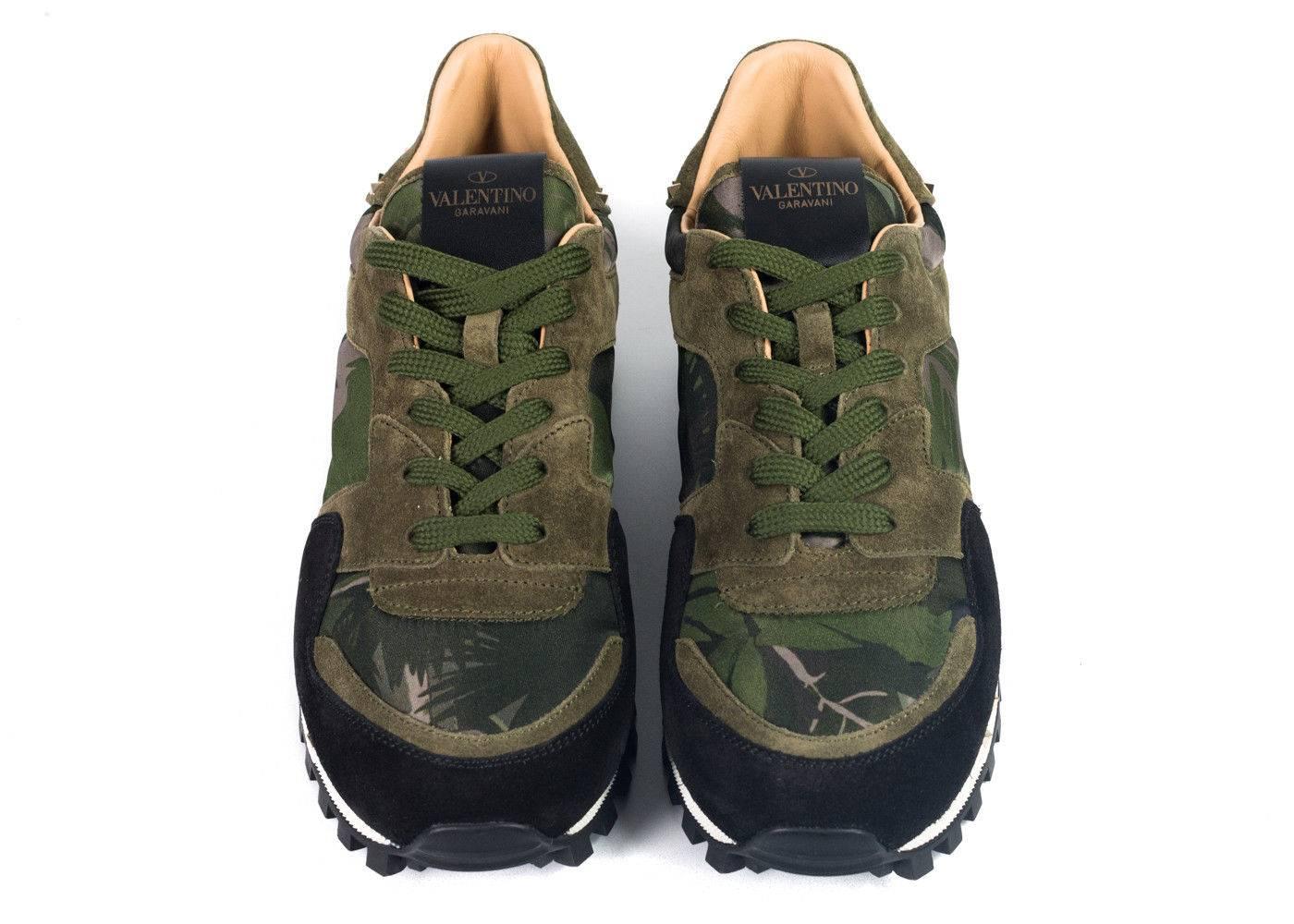Brand New in Original Box and Dust Bag
Retails in Stores and Online for $795
Size Euro 45 US 12 Fits True To Size


Low-top nylon sneakers featuring camouflage pattern in green and black. Suede trim in green throughout. Round toe. Lace-up closure.