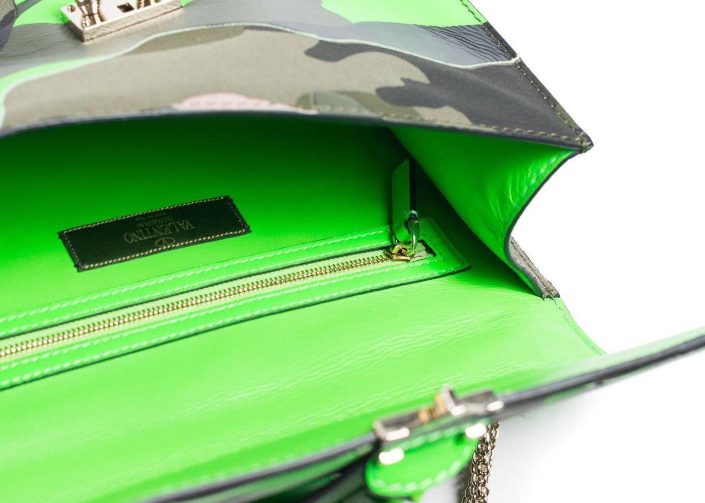Brand New Valentino Neon Green Camo Rocklock Shoulder Bag
Original with Tags and Sleeper Bag
Retails in Stores & Online for $2395
Size: 10.5 W x 3 D x 7 H

Valentino's vibrantly updated Rocklock Bag is a must have essential. This camouflaged