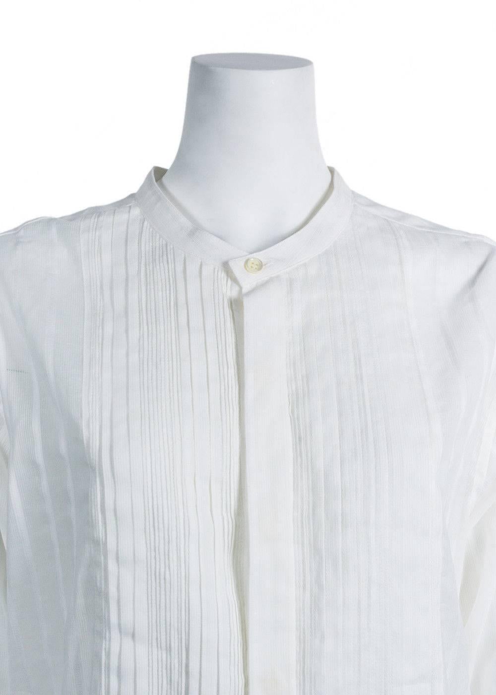 Brand New Saint Laurent Tunic
Original Tags & Hanger Included
Retails in Stores & Online for $1350
Size IT38 / US2 Fits True to Size

Saint Laurent's long-sleeve tunic blouse is constructed of white plain-weave cotton embroidered with tonal textured