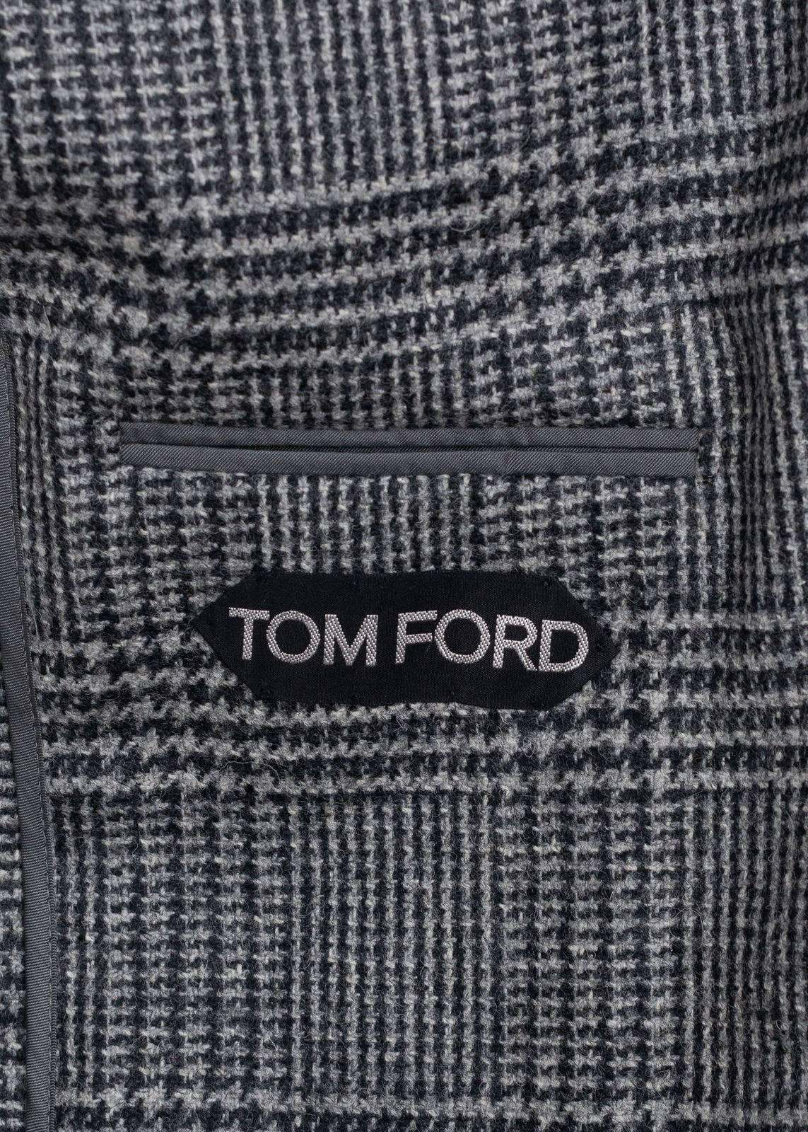 Step into the season in your durable Tom Ford Sports Jacket. This high quality Wool Jacket piece features classic Shelton Cut, 100% Wool, Houndstooth Pattern  2 Button and Single Vent. Pair this streamlined modern classic Jacket with black skinny