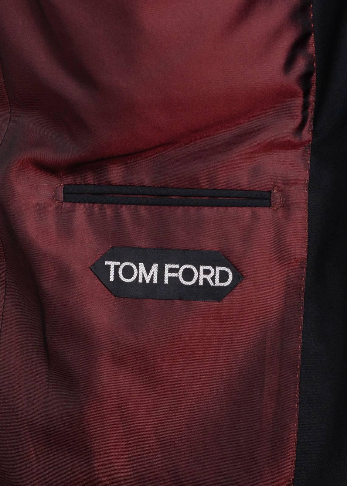 Settle into your Tom Ford Windsor jacket for the day or night. This durable wool jacket features a double button closure, peak lapel, and red silk infused interior lining. You can pair this piece with rich deep burgundy slacks with the luxury of